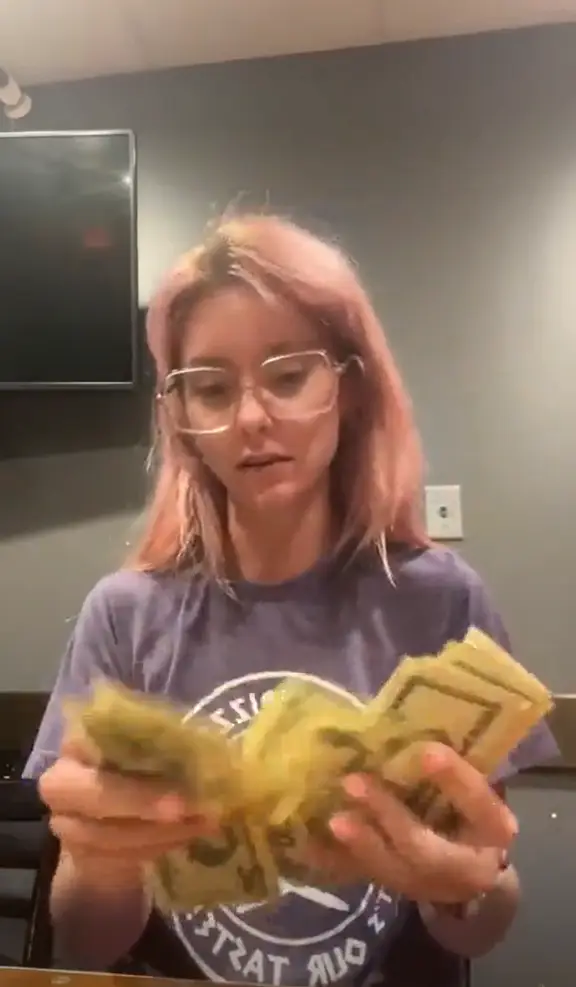 A waitress showed off her tips from just one shift, totalling nearly $700.