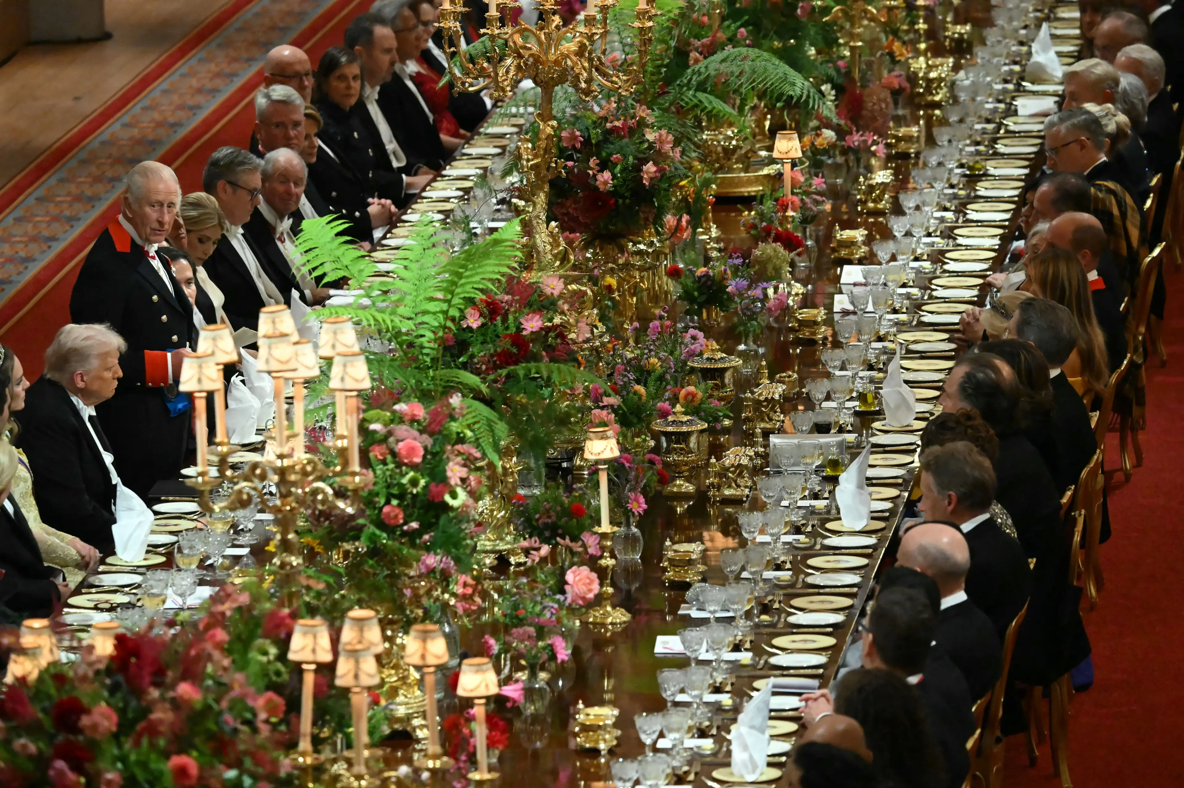 Royals don't like when you take pictures of your food, apparently (ANDREW CABALLERO-REYNOLDS/POOL/AFP via Getty Images)