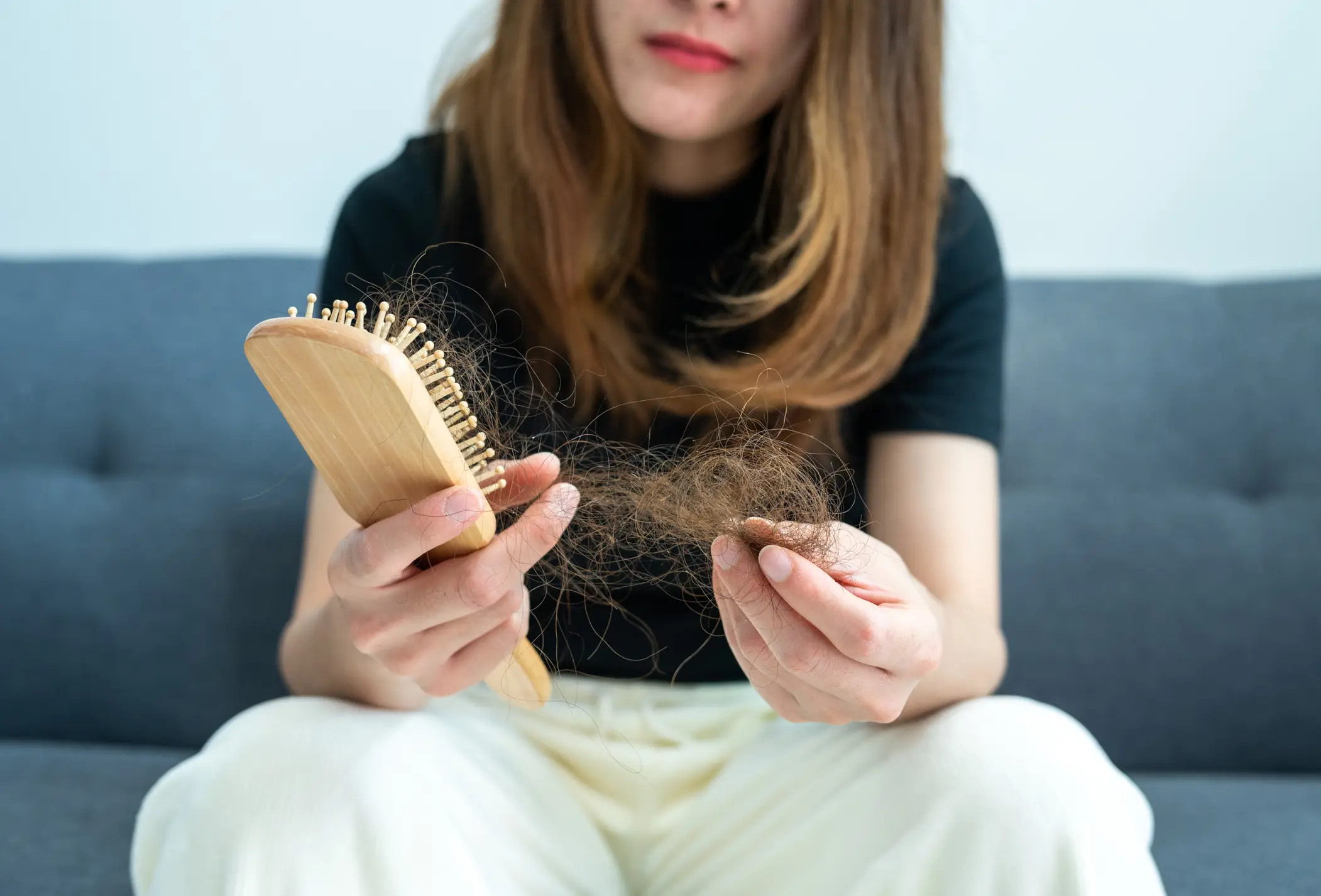 Hair loss can be a sign of a vitamin B2 deficiency (Boy_Anupong/Getty Images)