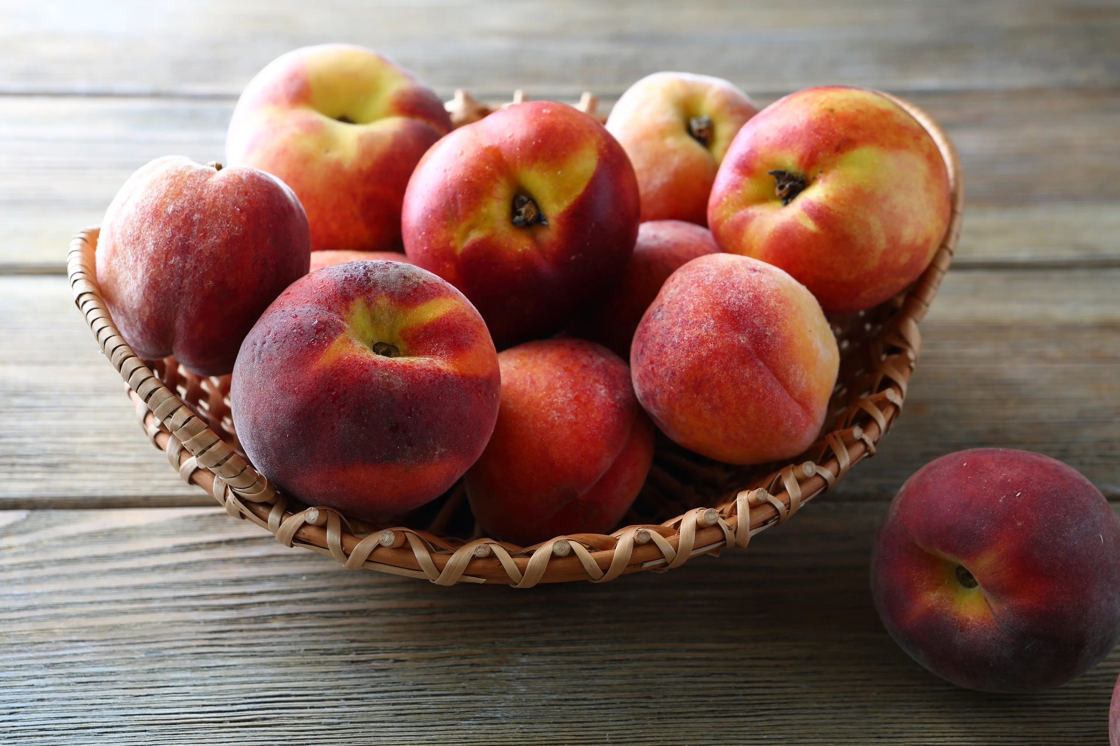 Peaches, apples, and various berries are also notorious for harbouring pesticides (Erika Bunea/Getty Stock Image)
