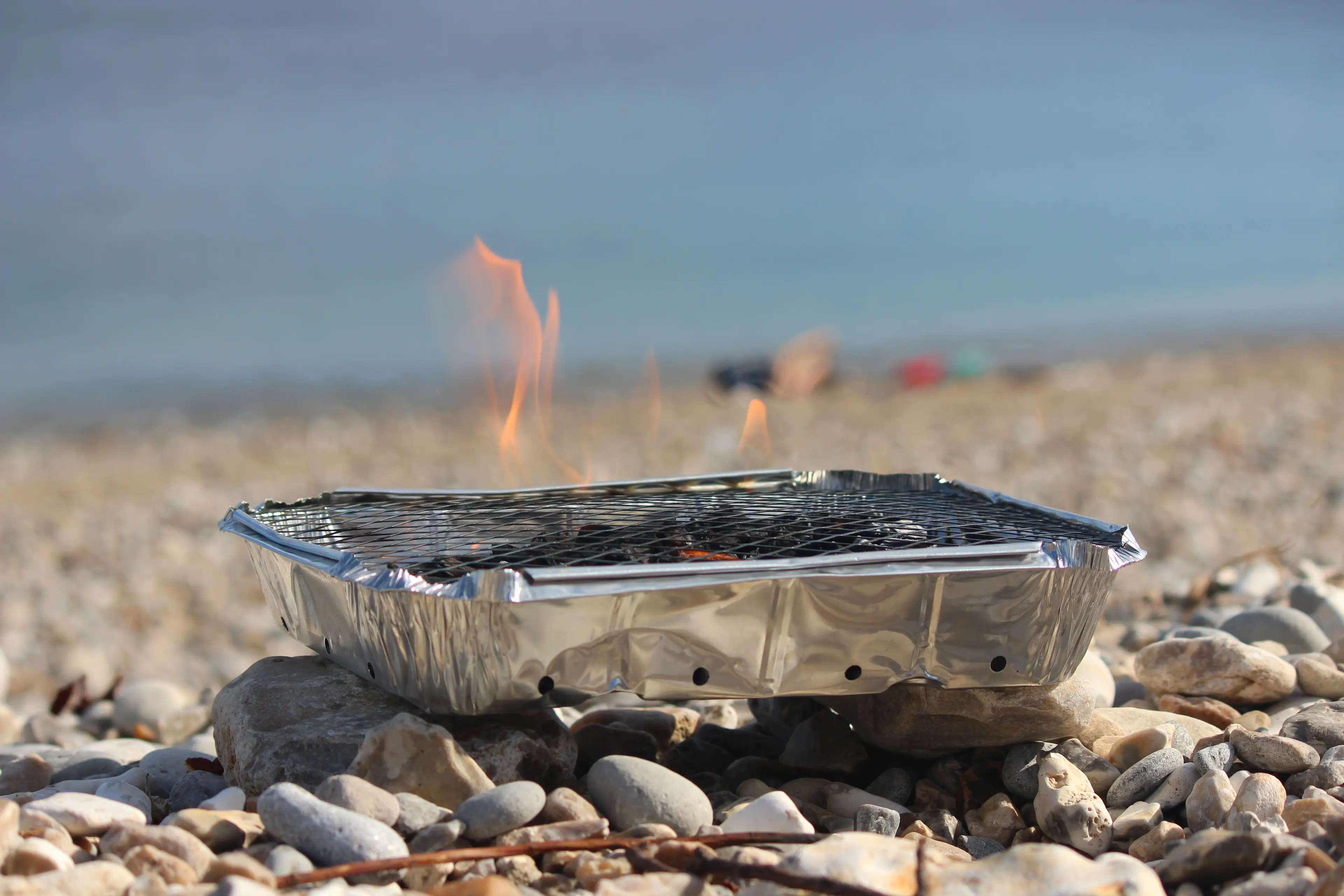 You could risk a £1,000 fine if you're caught using a disposable BBQ on a beach that has banned it (Getty Stock Image)