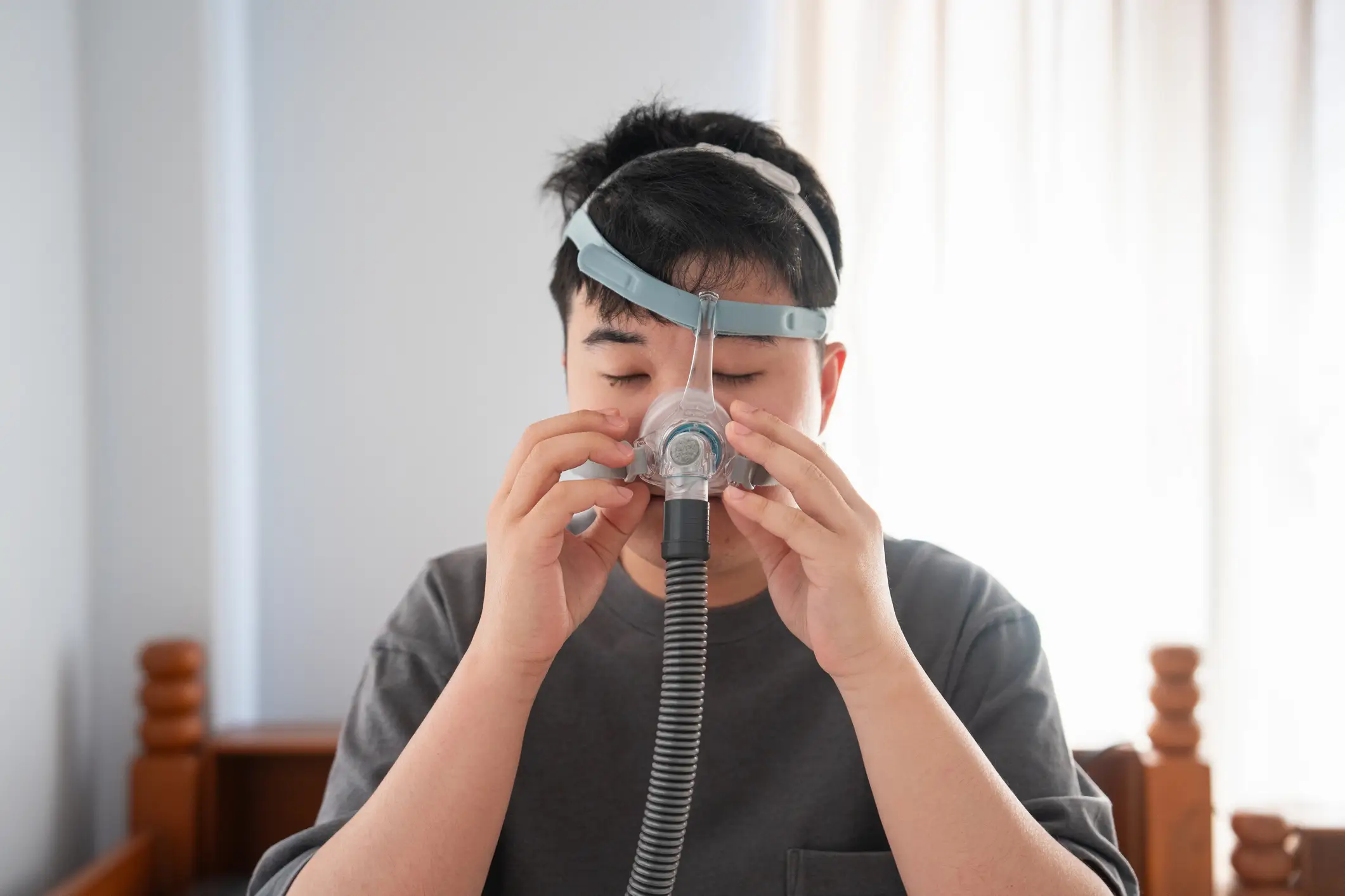 CPAP machines can mitigate the effects of sleep apnea (Jackyenjoyphotography/Getty Images)