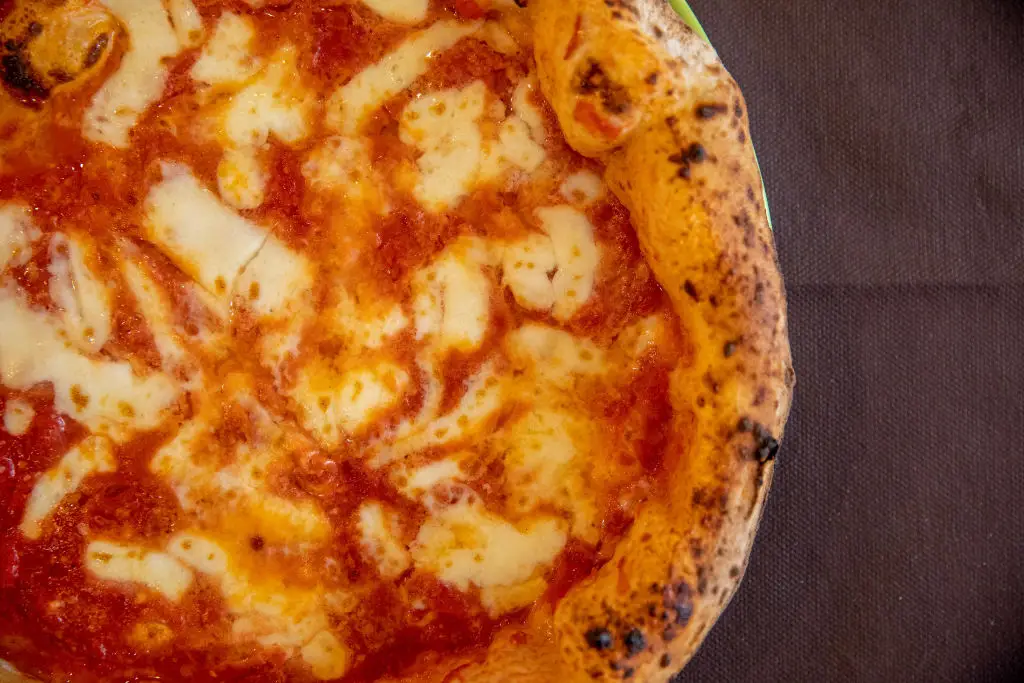 Prison dinner swapped champagne toasts for pizza, pasta and green beans (Alessio Paduano/Bloomberg via Getty Images)