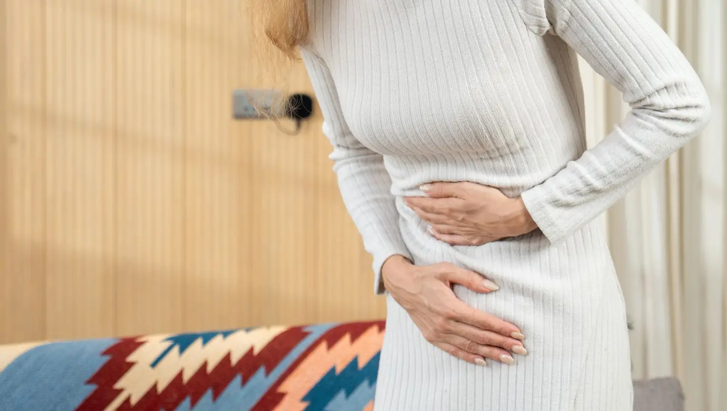 Common symptoms include stomach cramps and headaches (Getty Stock Image)