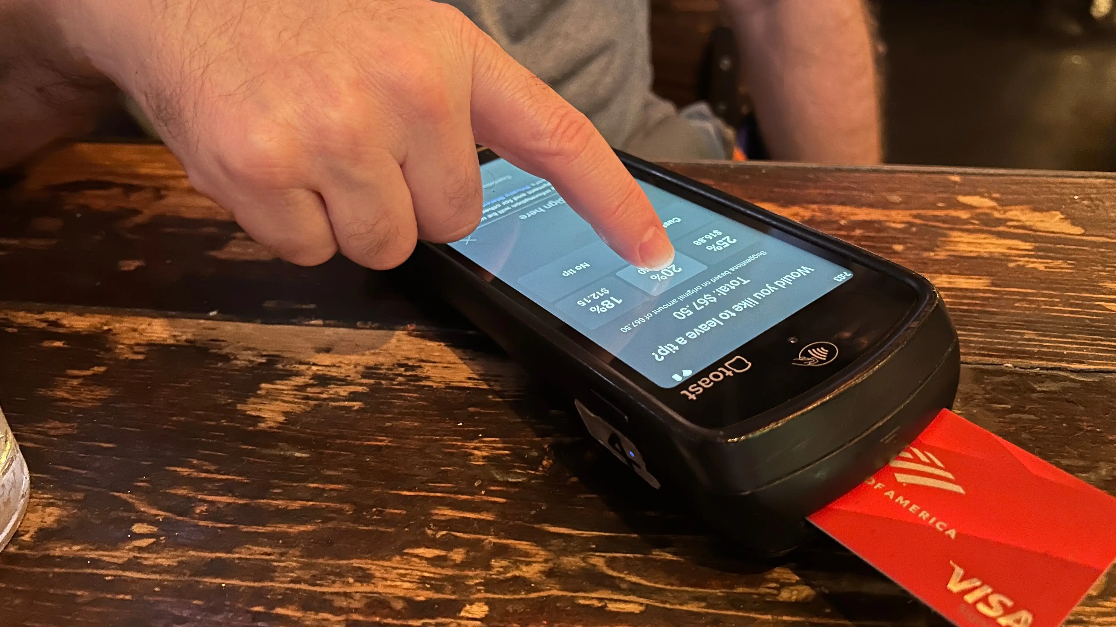 Customer shares warning to others after being charged for tip despite not paying one