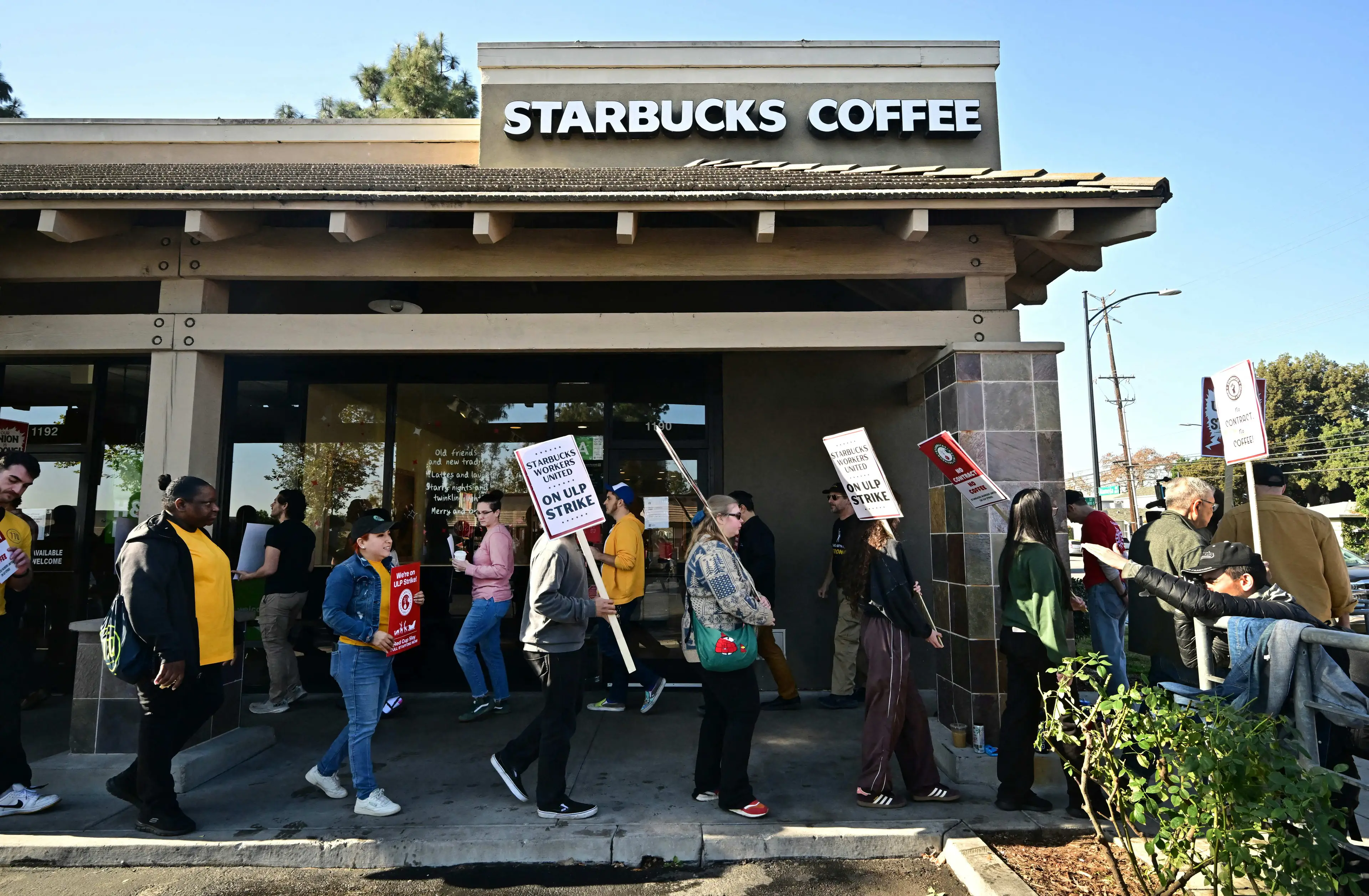 Striking workers in December last year (Frederic J. BROWN/AFP via Getty Images)