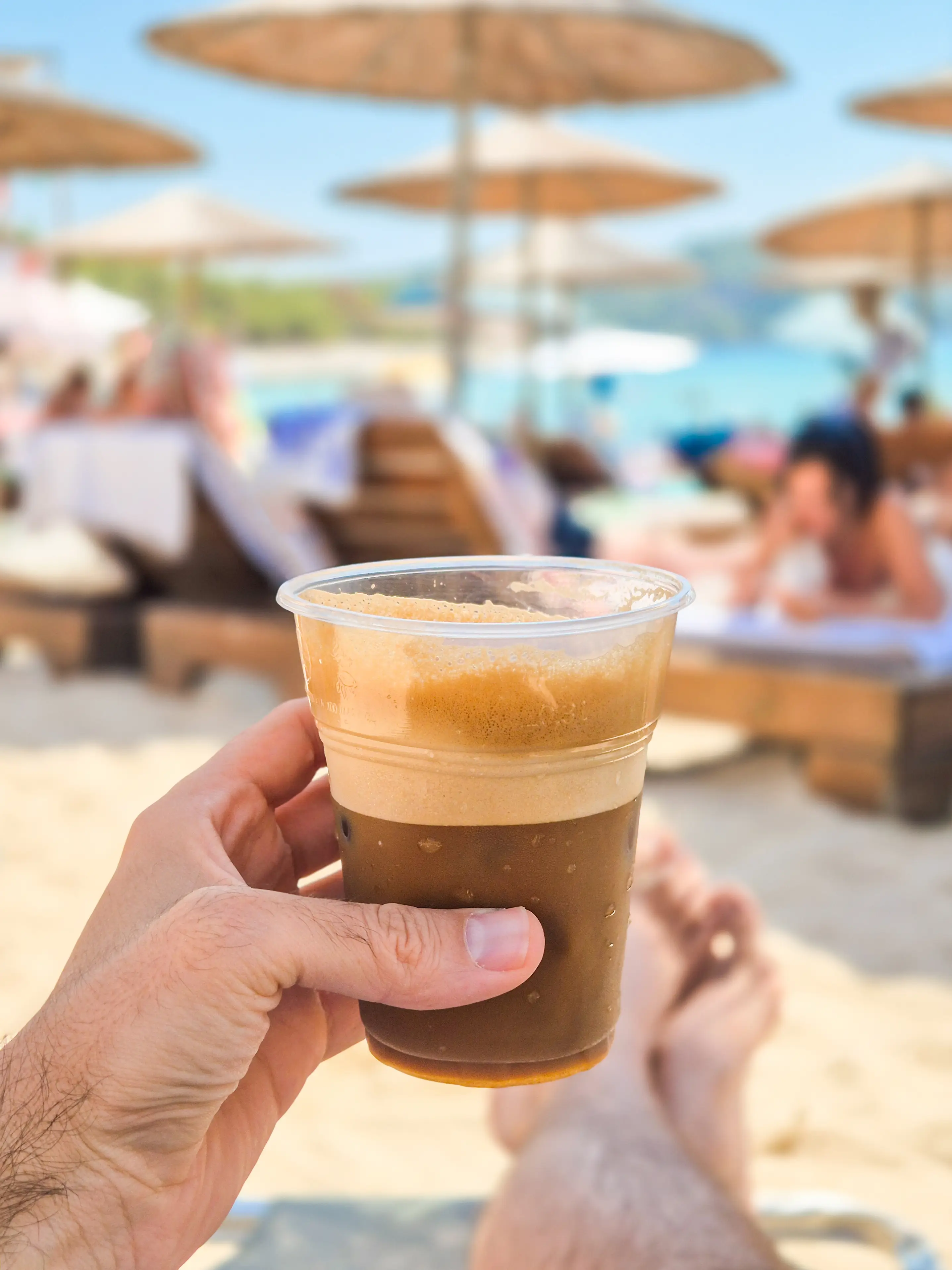 Drinking a Freddo espresso on a Greek beach sounds like a good time to us (Getty Stock Image)