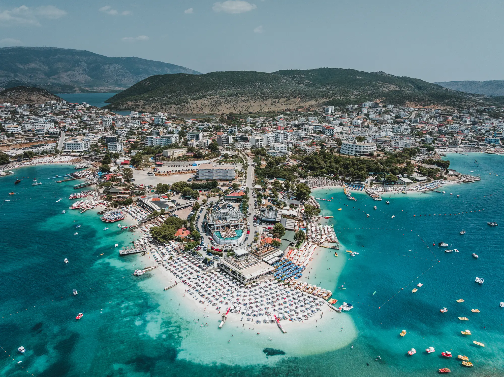 Ksamil’s rising popularity comes from tropical scenery paired with surprisingly low everyday costs (Abstract Aerial Art/Getty Images)