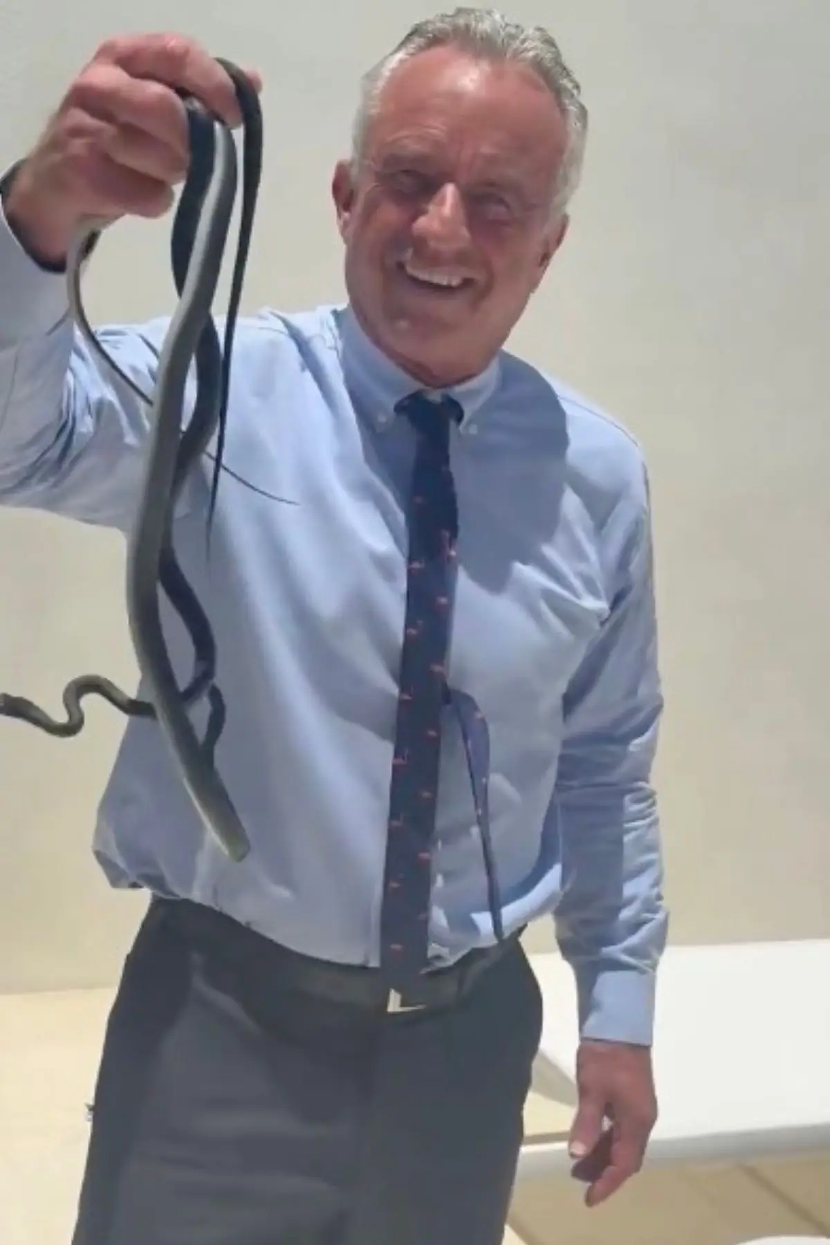 Robert F. Kennedy Jr. has gone viral for picking up two biting snakes (X/@robertkennedyjr)