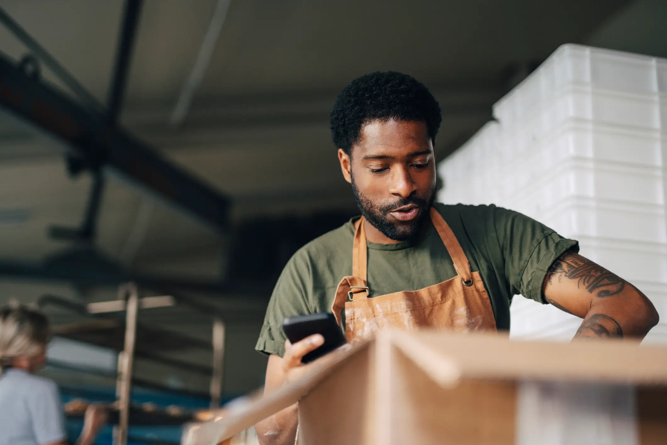 Cooking with your phone in the kitchen could be spreading germs and food borne illnesses (Getty Images/Maskot)