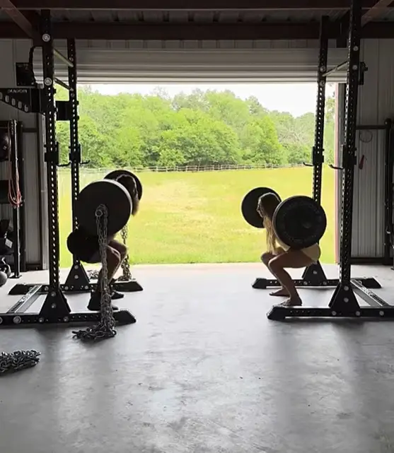 Johnson working out at home with wife Barbara (Liver King/YouTube)