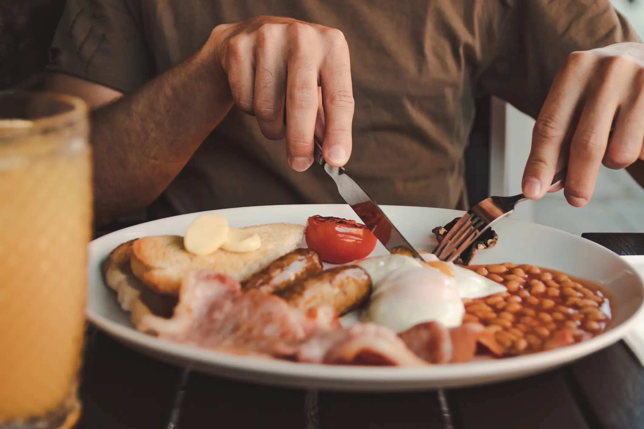 Tucking into a Full English - NDStock via Getty Images