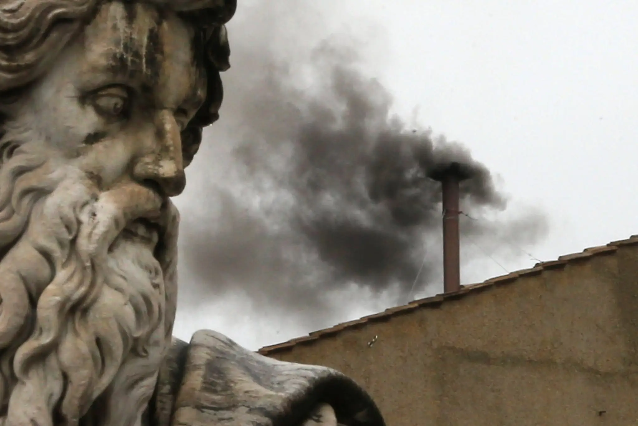 Black smoke billows from the chimney of the Sistine Chapel on 13 March, 2013 (Dan Kitwood/Getty Images)
