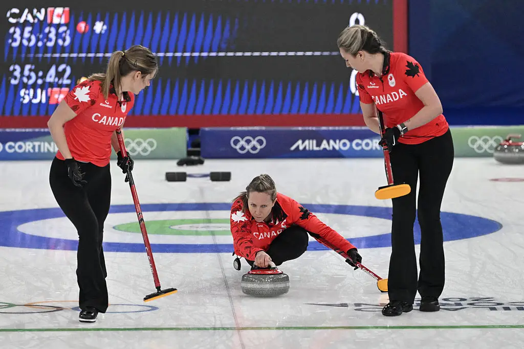 The Canadian teammates were called for 'double-touching' (Rachel Homan / Getty Images)