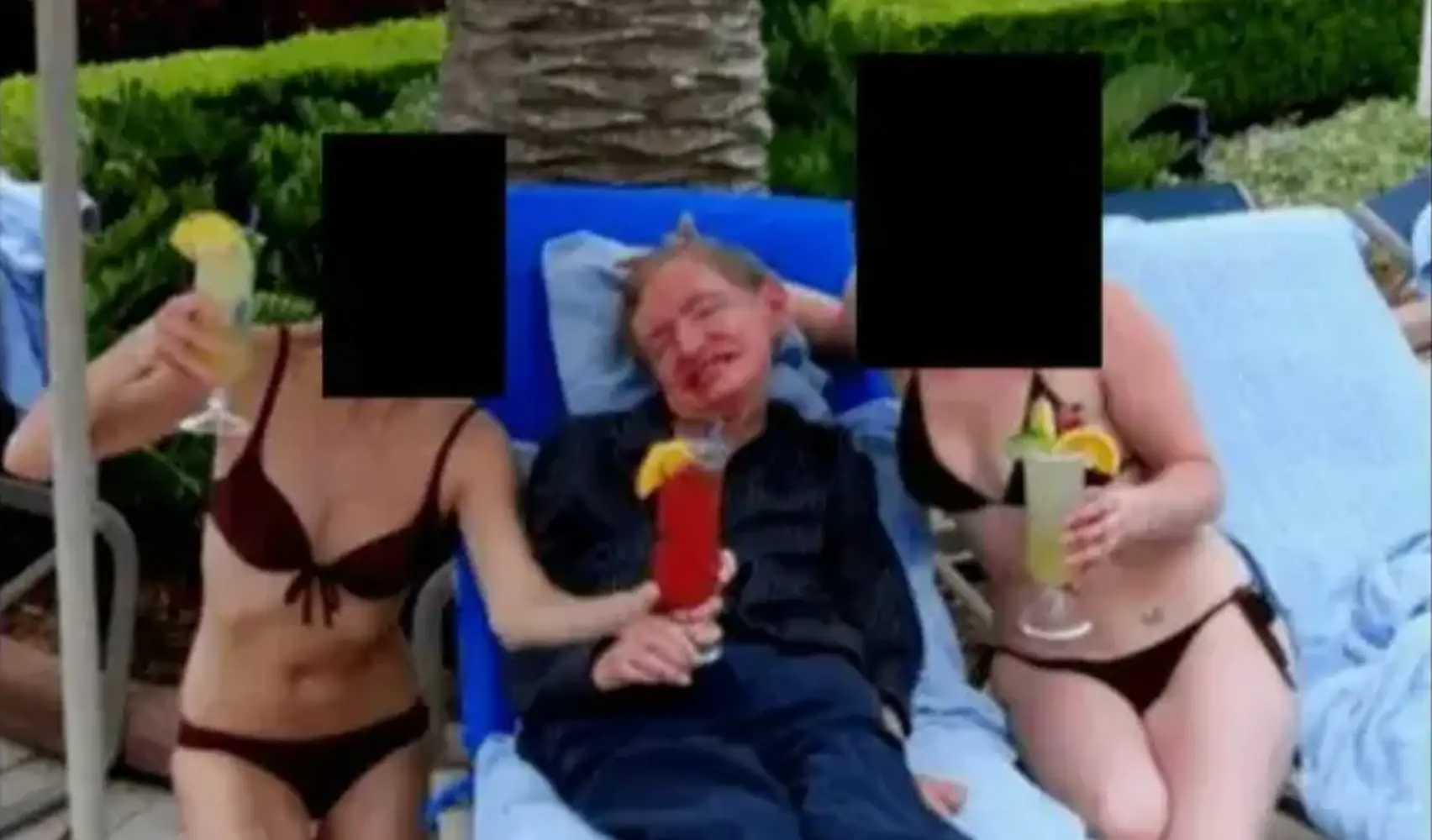 Hawking was pictured with two women in bikinis (DOJ)