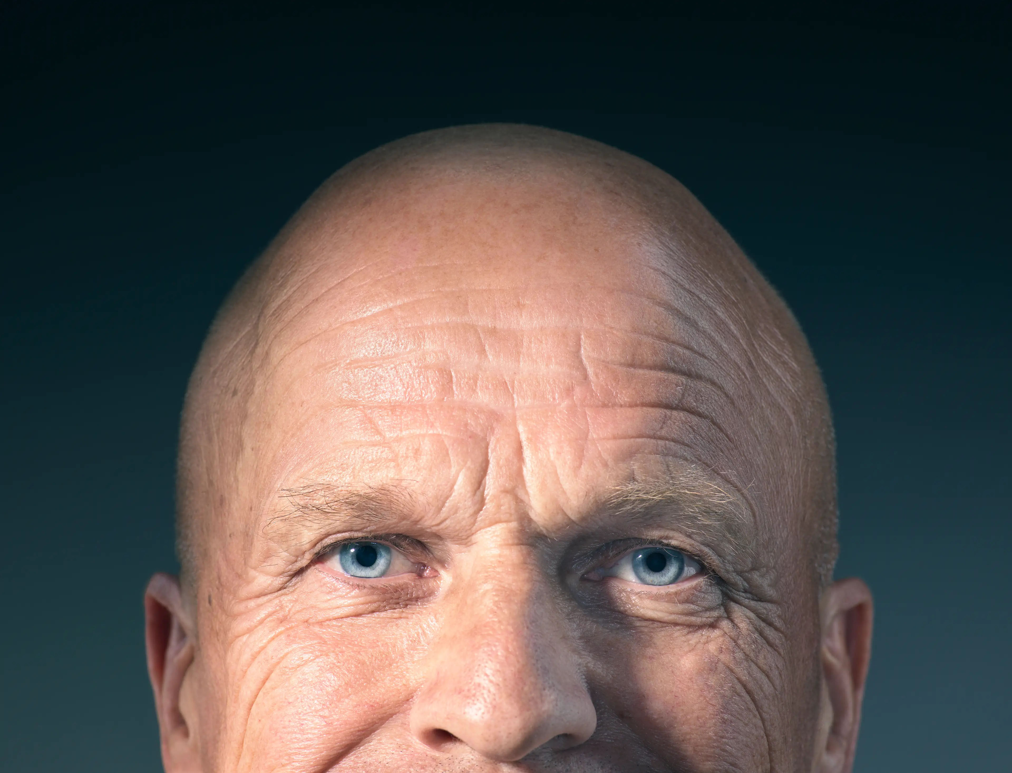 Everyone with blue eyes shares a common ancestor from 6,000 to 10,000 years ago. It's not this guy, he's a stock photo model.