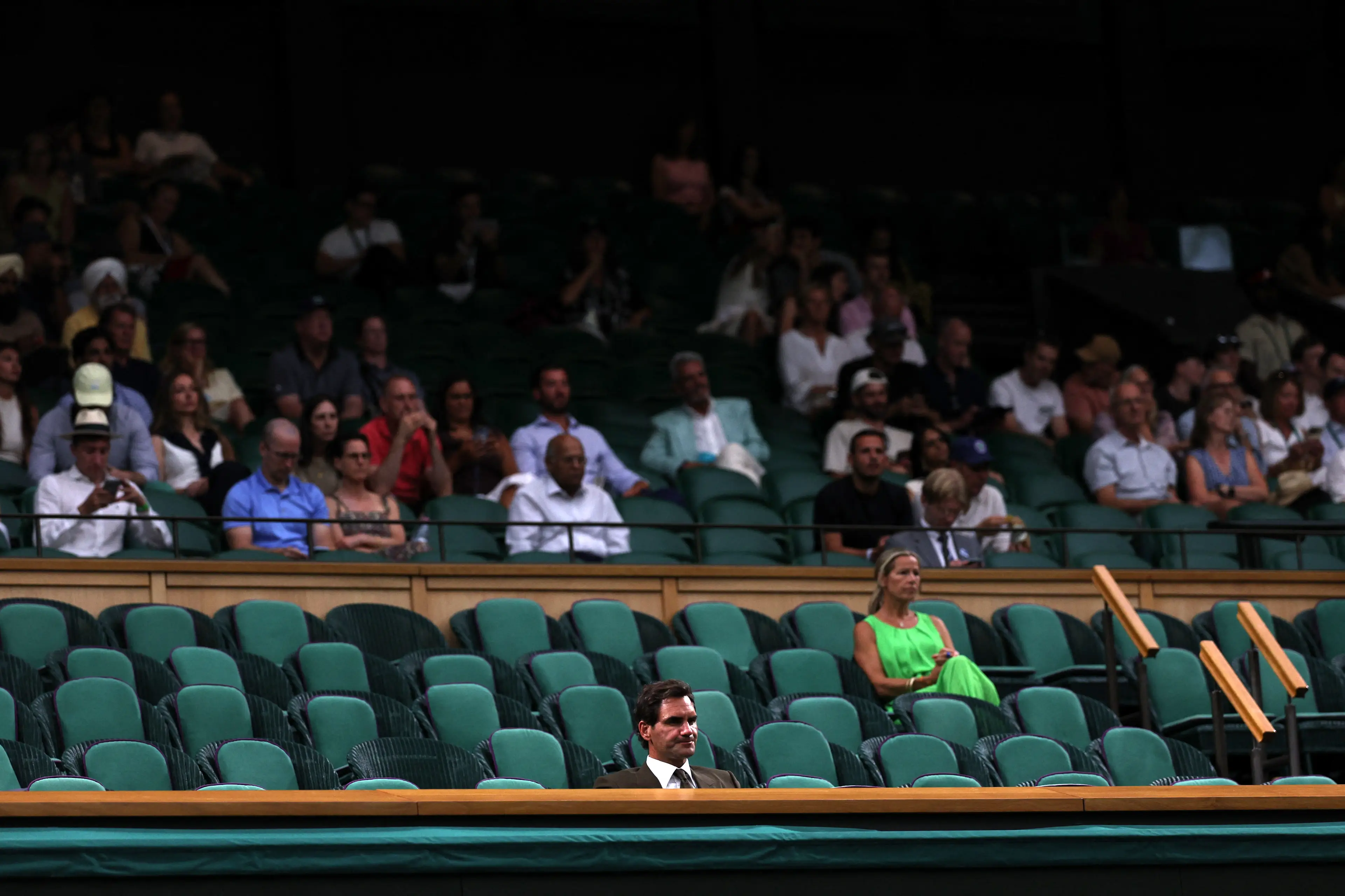 Roger Federer was all on his own inside the Royal Box on Monday (Adrian Dennis / AFP via Getty Images)