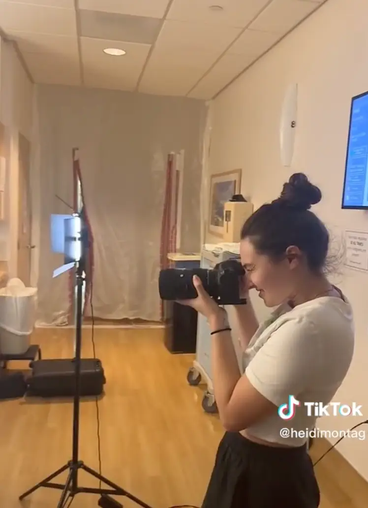 A photographer is also present in the hospital room.