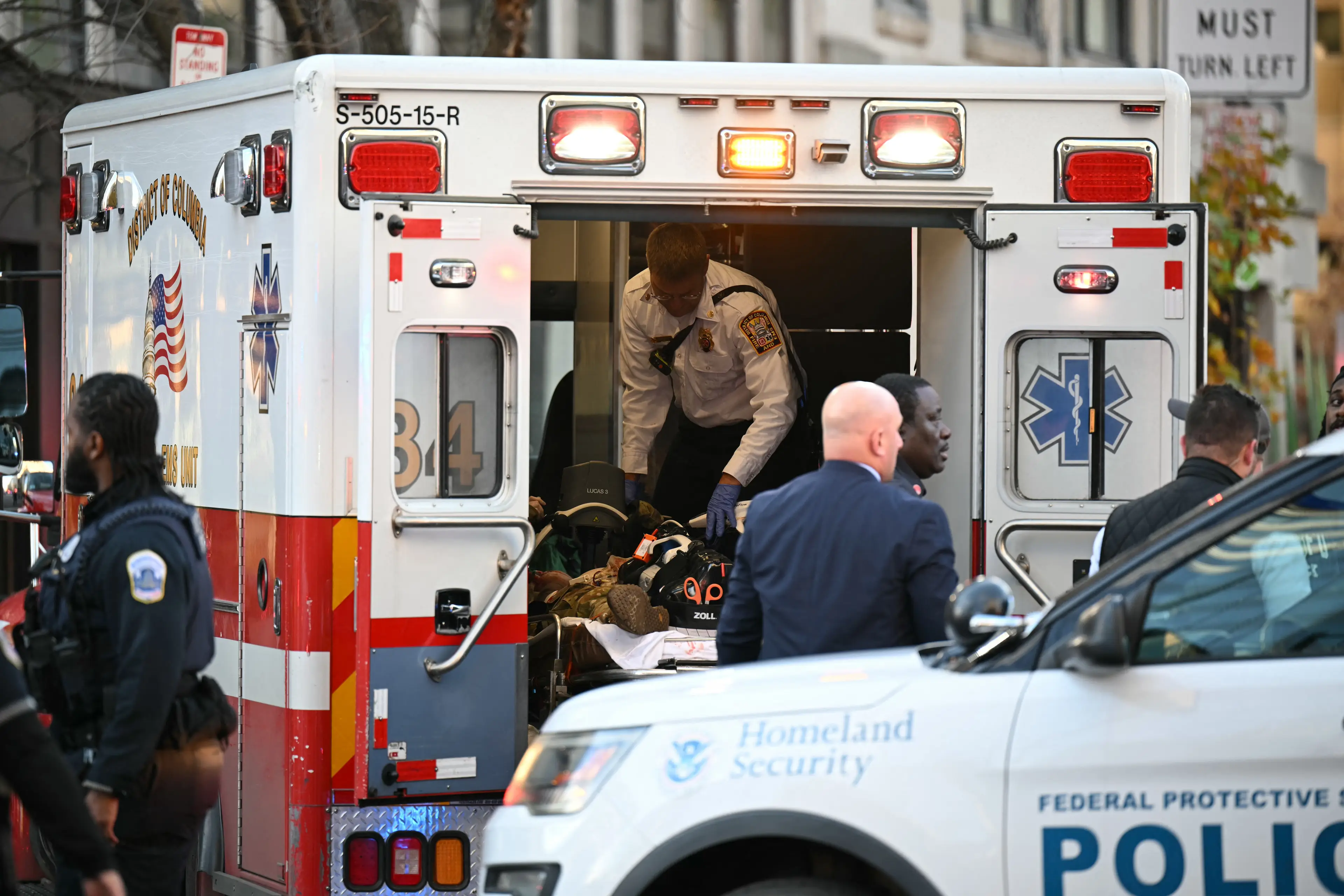 Another guard,  Sgt. Andrew Wolfe, is said to be 'fighting for his life' (Drew ANGERER / AFP via Getty Images)