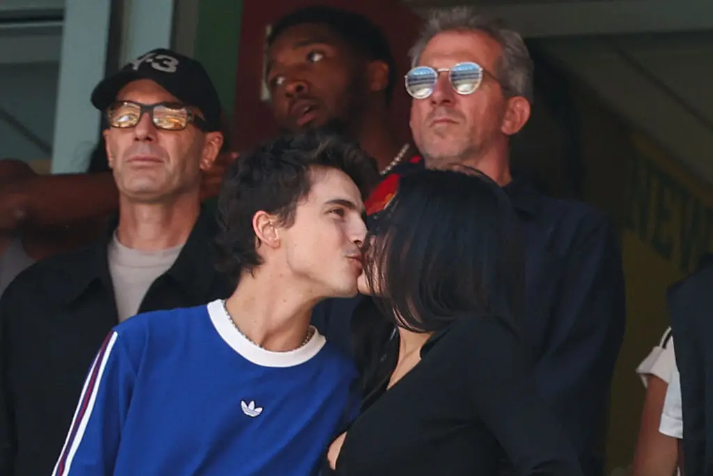The lovebirds couldn't keep their hands off each other (Photo by FRANCK FIFE / AFP via Getty Images)