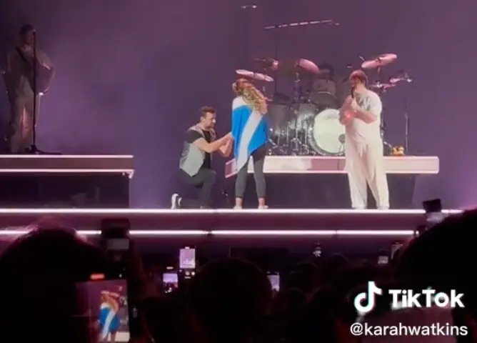 Sam swiftly got down on one knee.