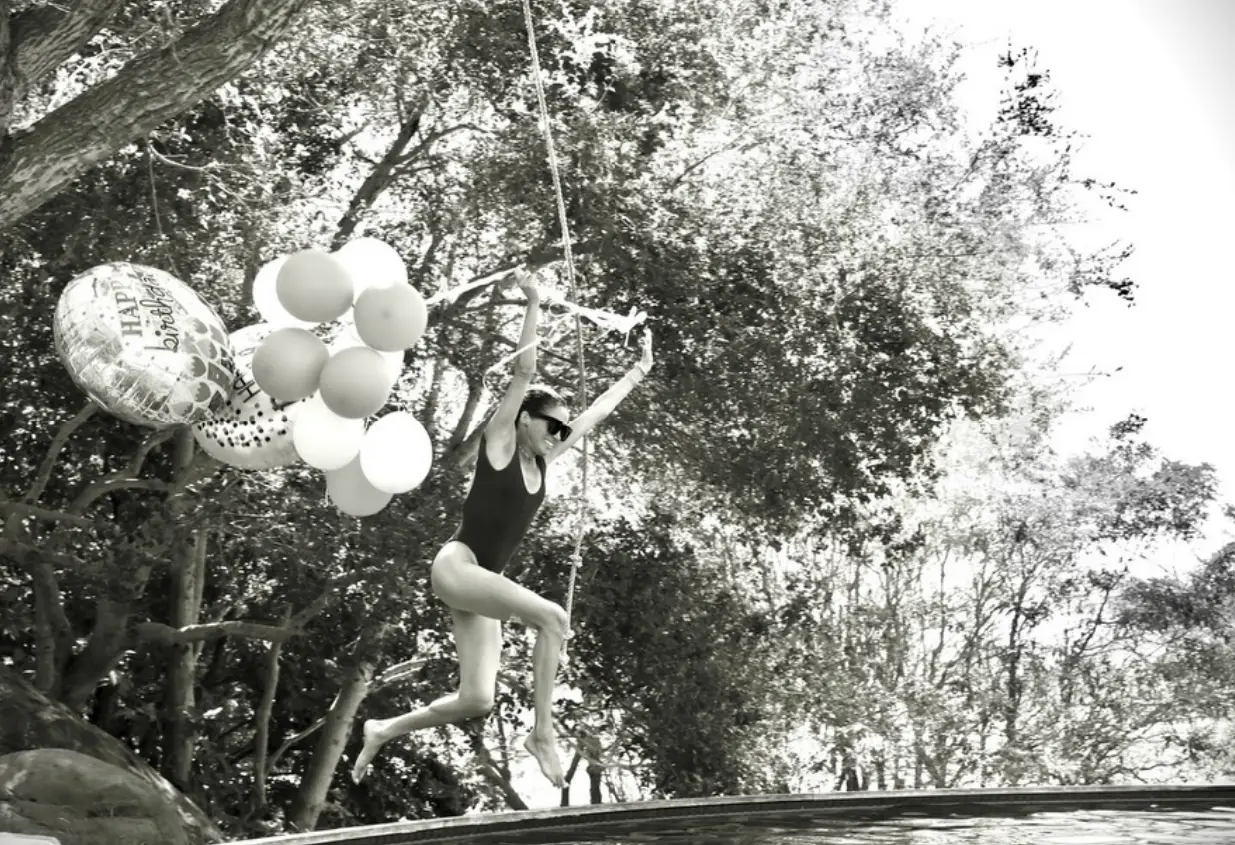 Meghan looked the picture of happiness as she jumped into the pool with the balloons to celebrate her birthday (Instagram.com/@meghan)