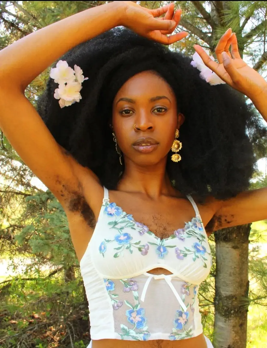 Queen Esie proudly showcases the hair on her chest, as well as her legs, stomach and underarms, and is absolutely rocking it.