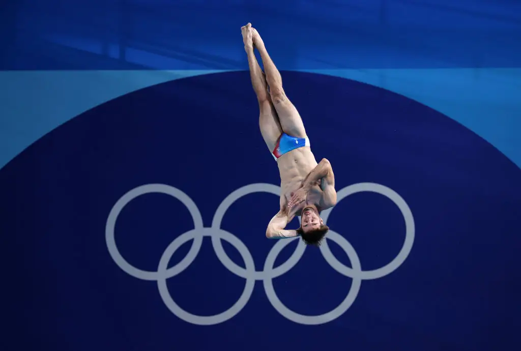 The official guidance for swimming costumes states that men's swimsuits 'shall not extend above the navel nor below the knee'. (Adam Pretty / Staff / Getty Images)