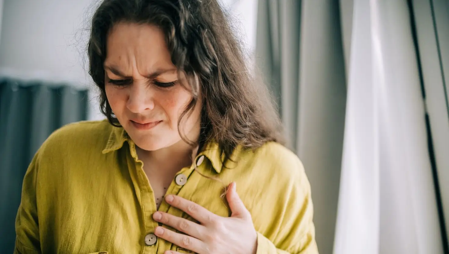 Chest pain and breathlessness could indicate you're suffering from the health complication (Getty Stock Image)