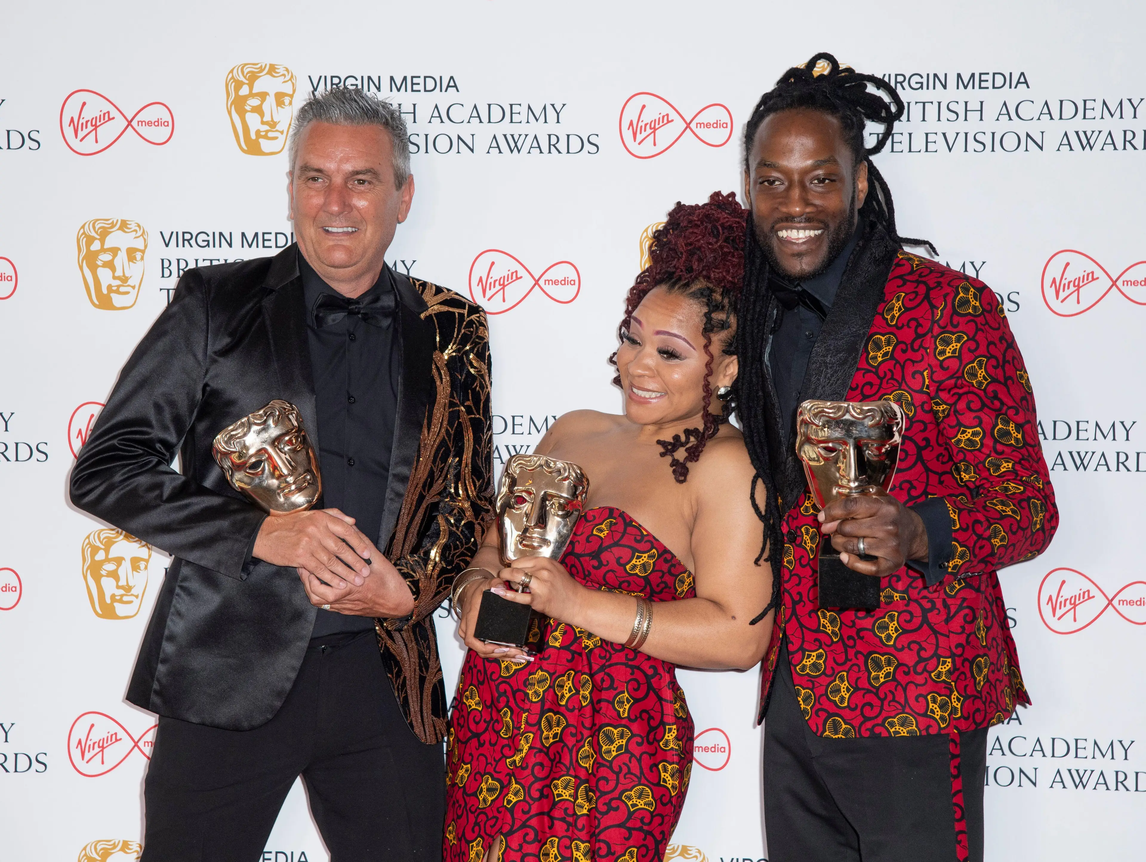 Marcus and Mica showing off a Gogglebox award with co-star Lee Riley.