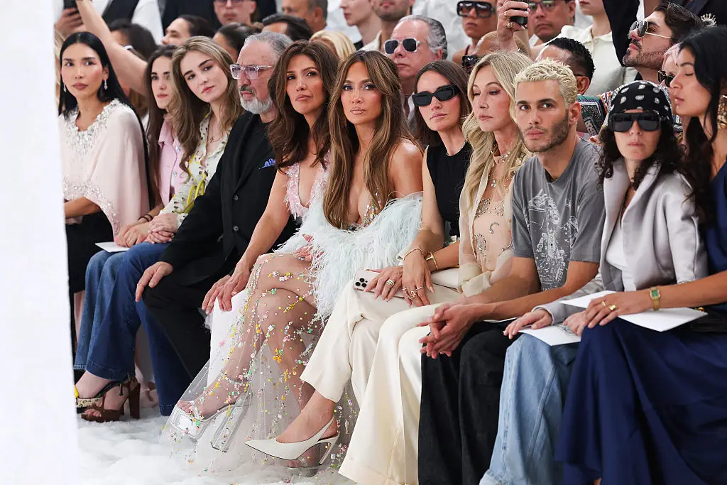 The A-List sisters had the best seats in the house for the swanky event (Victor Boyko/Getty Images)