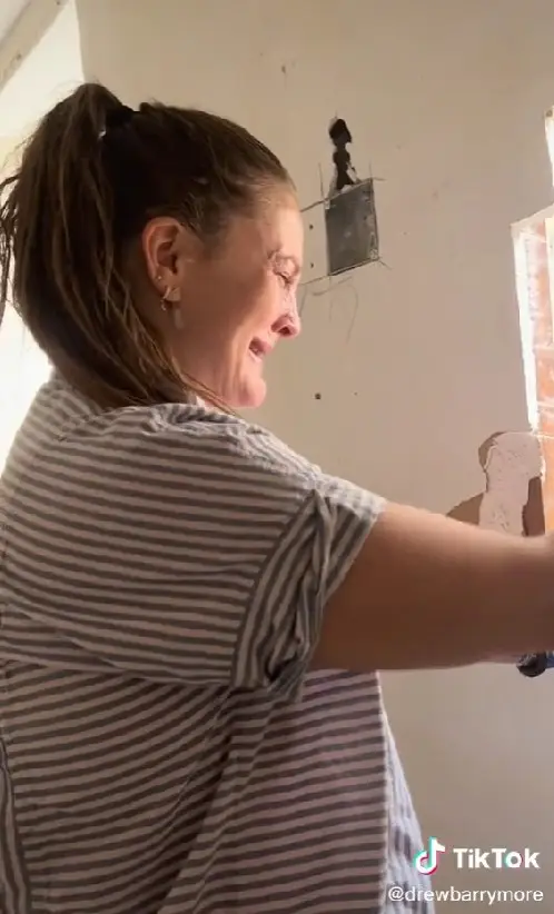 Drew Barrymore couldn't hide her emotion after finding a secret window in her apartment.