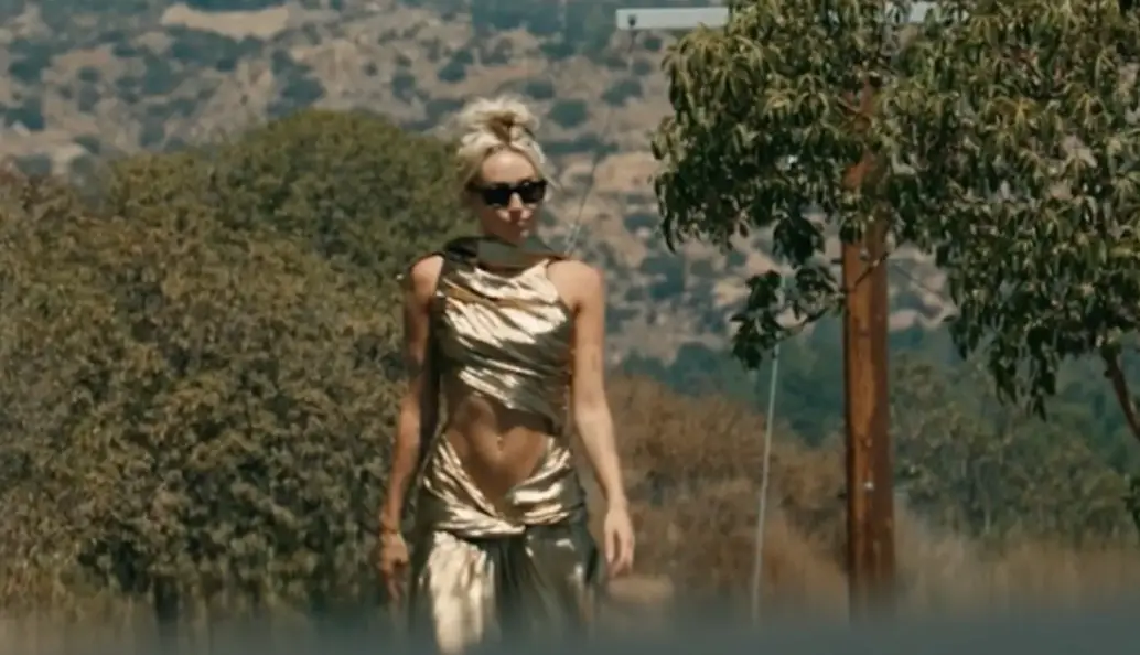 Miley Cyrus wore a gold dress for her music video (Colombia Records)