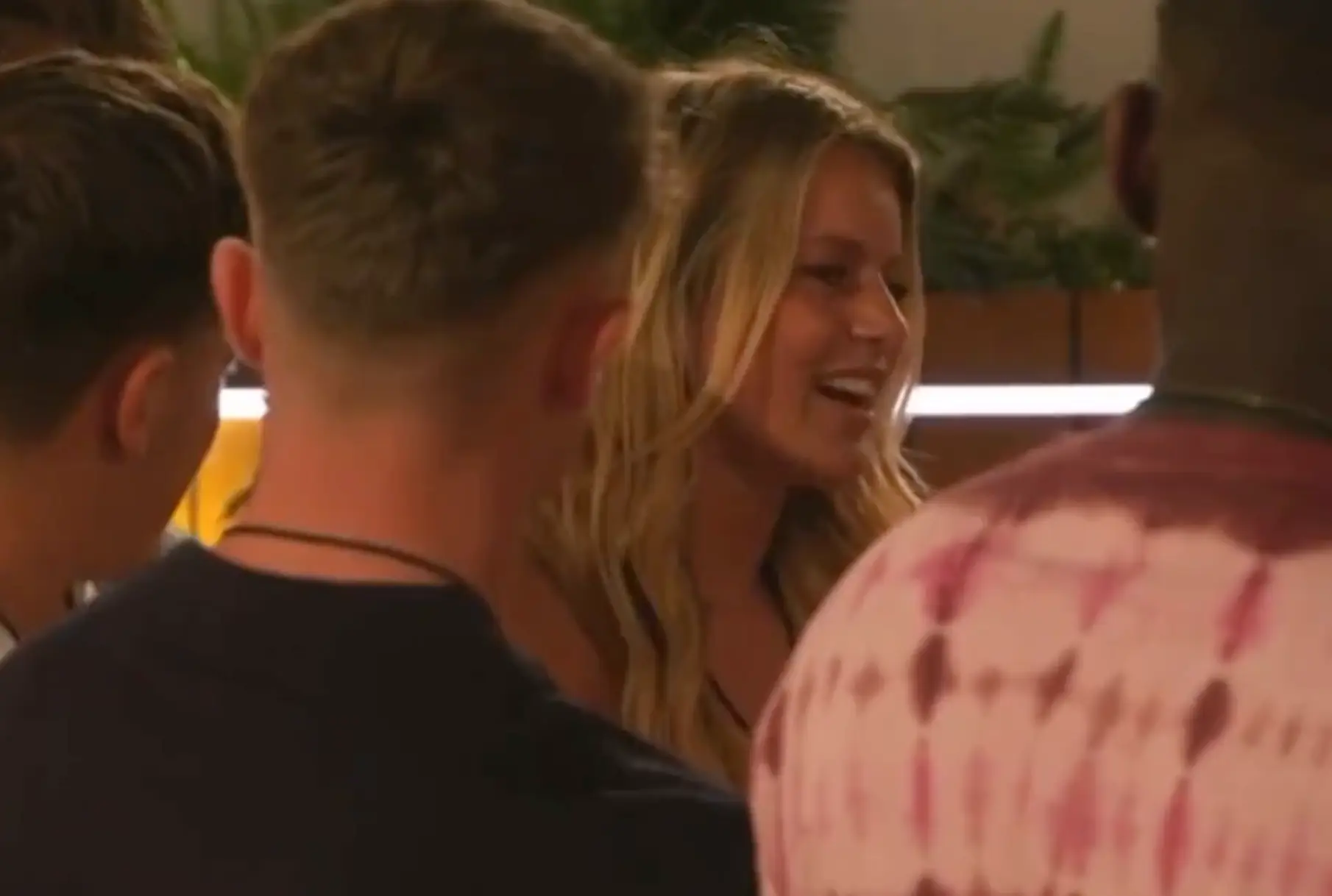 Tasha gathered the islanders around the firepit.