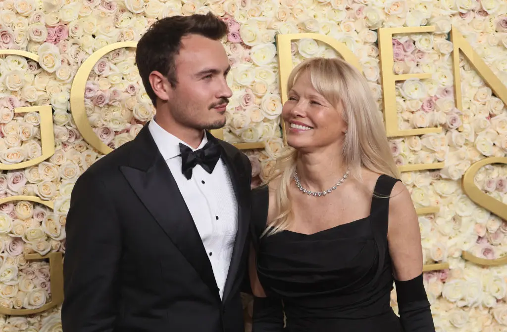 Anderson and her eldest son, Brandon Thomas, at the Golden Globes (ETIENNE LAURENT / Contributor / Getty Images)
