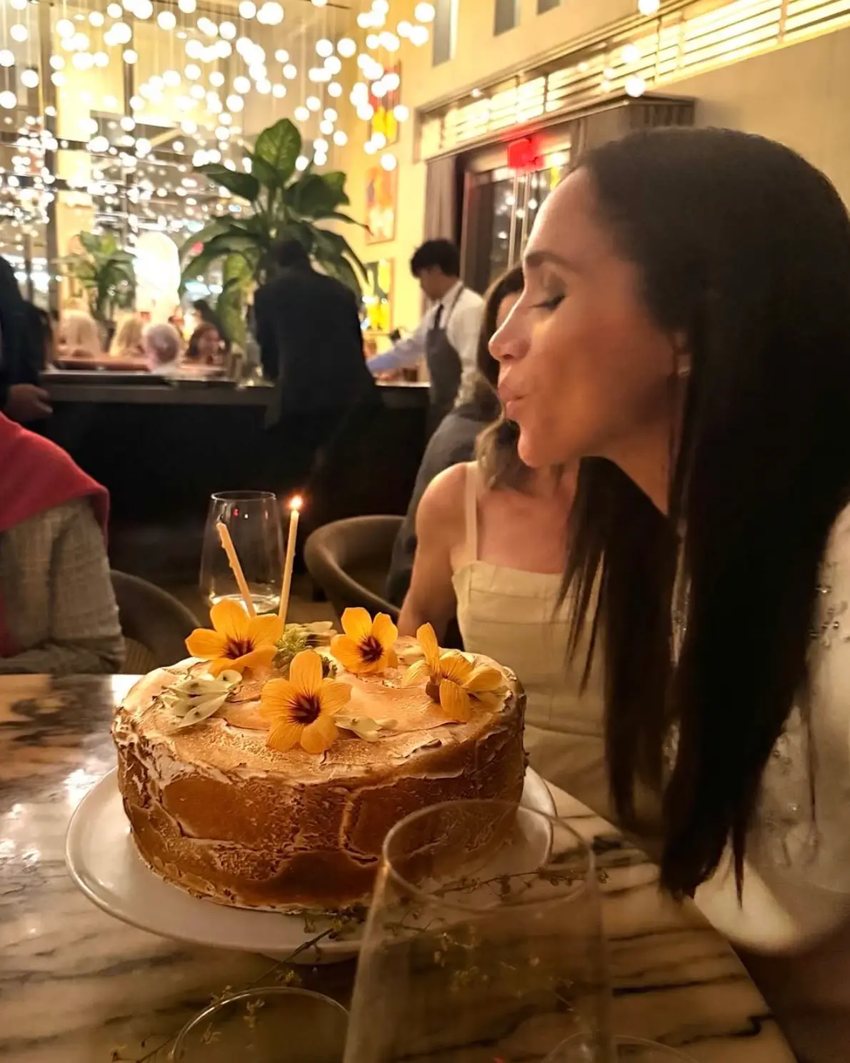 Meghan shared a photo of herself blowing out her candles (Instagram/@meghan)