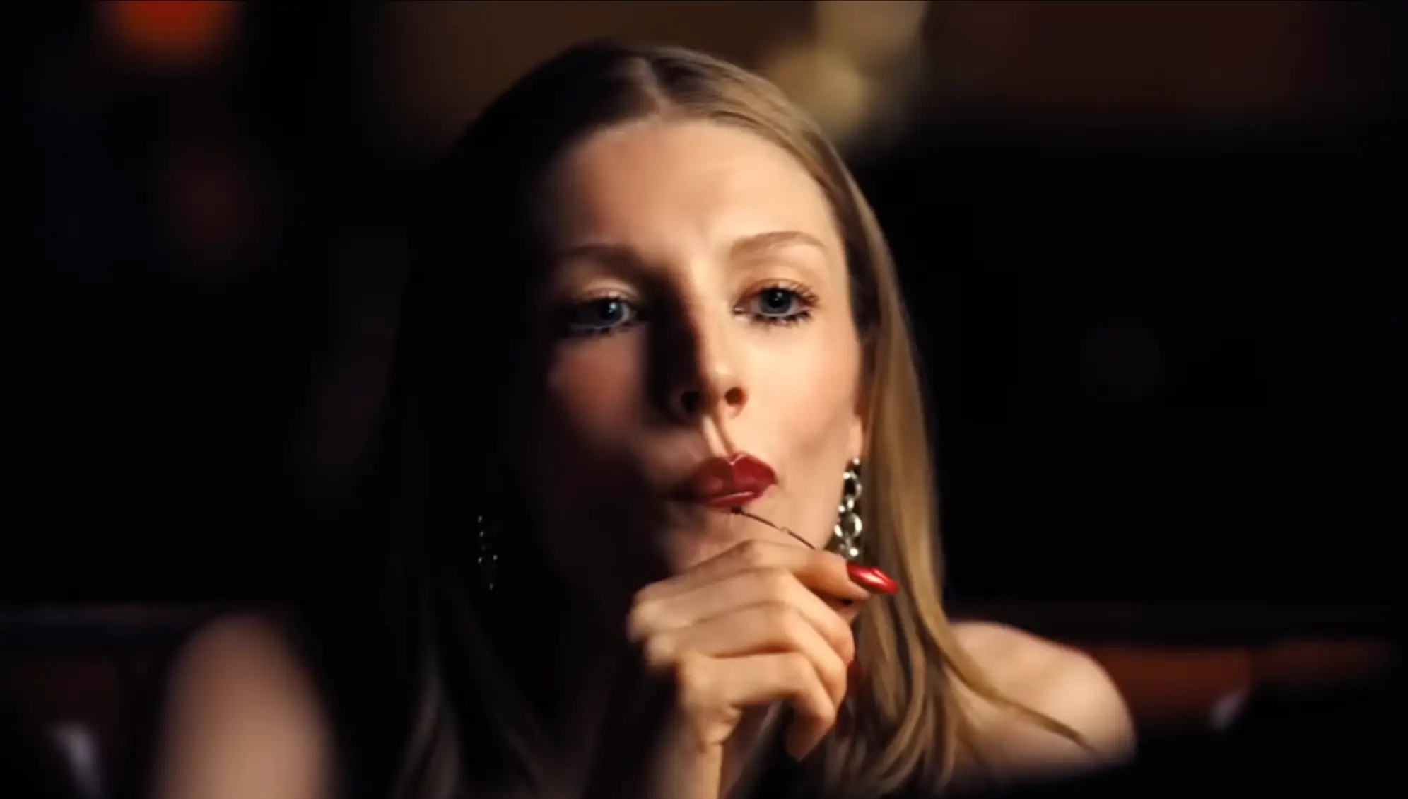 We see Jules go on dates with a few different wealthy men, who discreetly slip her money under the table (HBO)