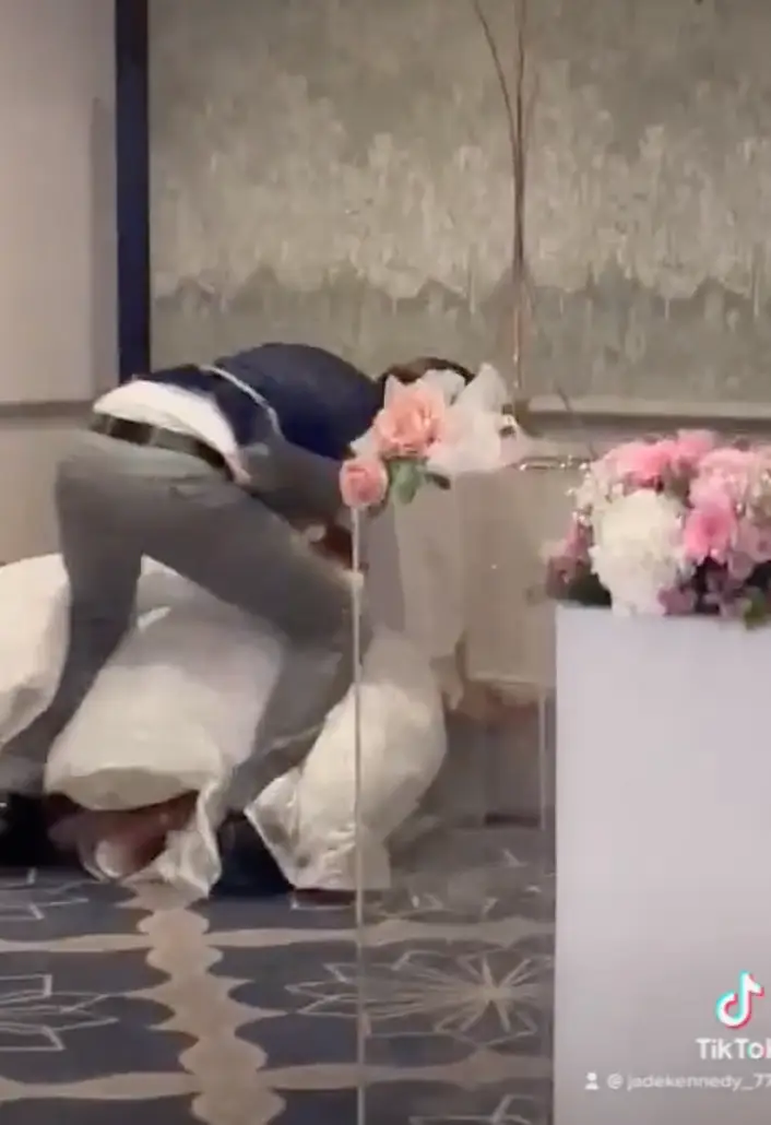 Jade ran into a corner but her husband still managed to smush the cake into her face, the pair falling to the floor.