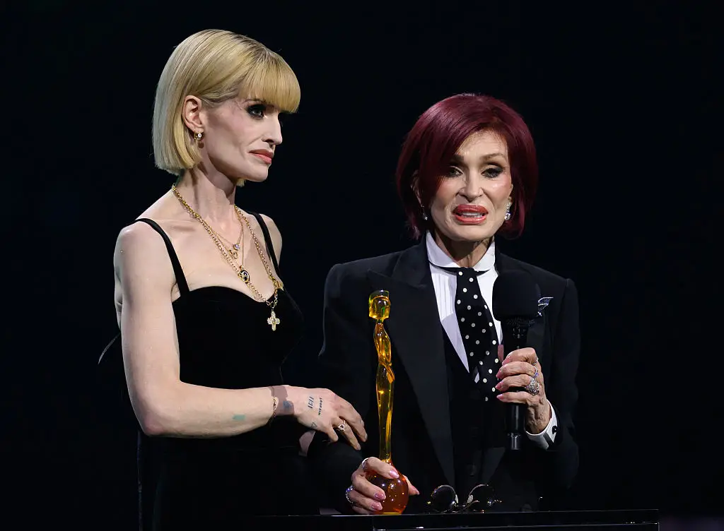 Kelly and Sharon accepted the Lifetime Achievement Award on behalf of Ozzy (Karwai Tang/Getty Images)