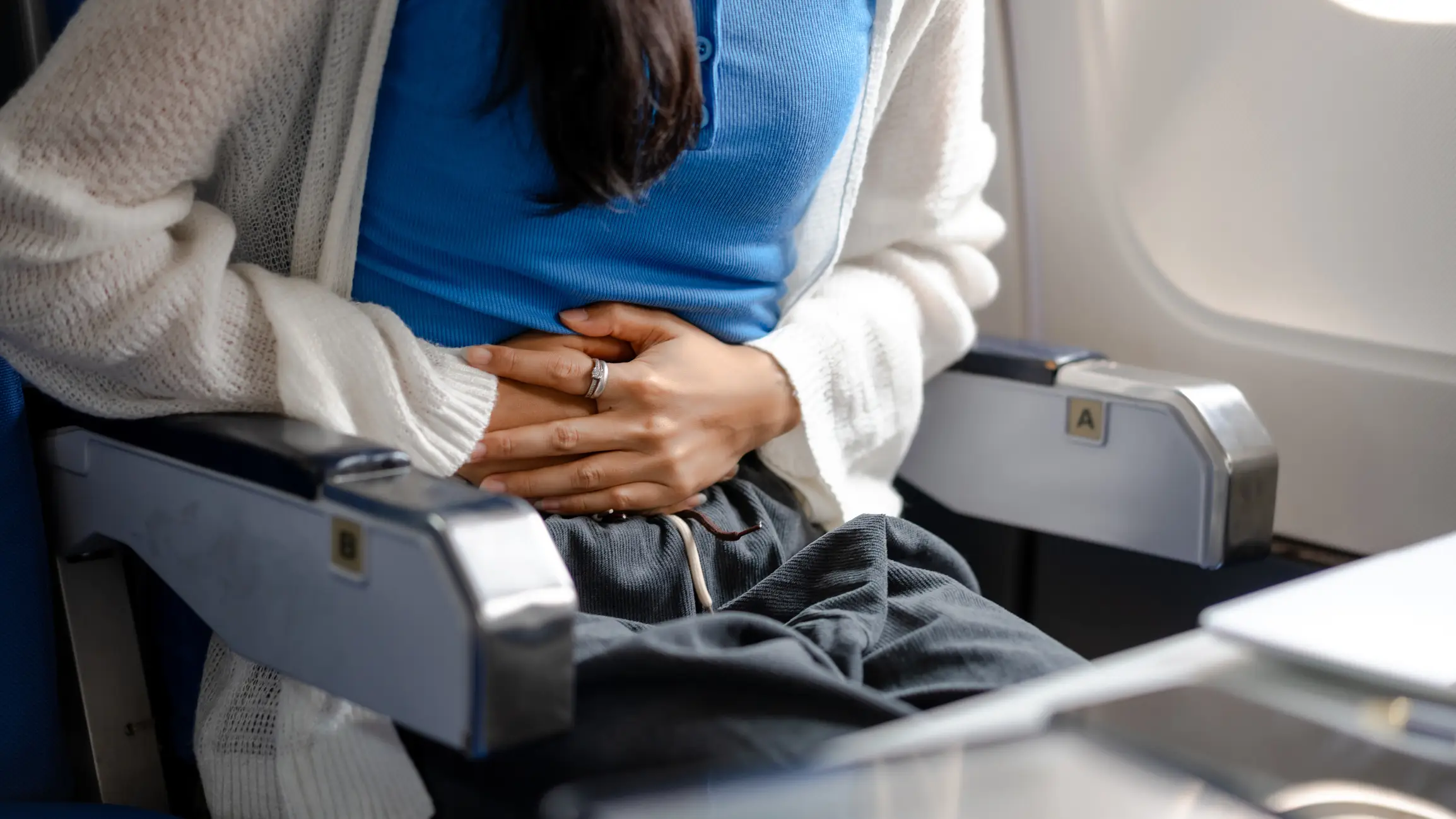 A doctor has explained the 'airplane belly' side effect of flying (Getty Stock Images)