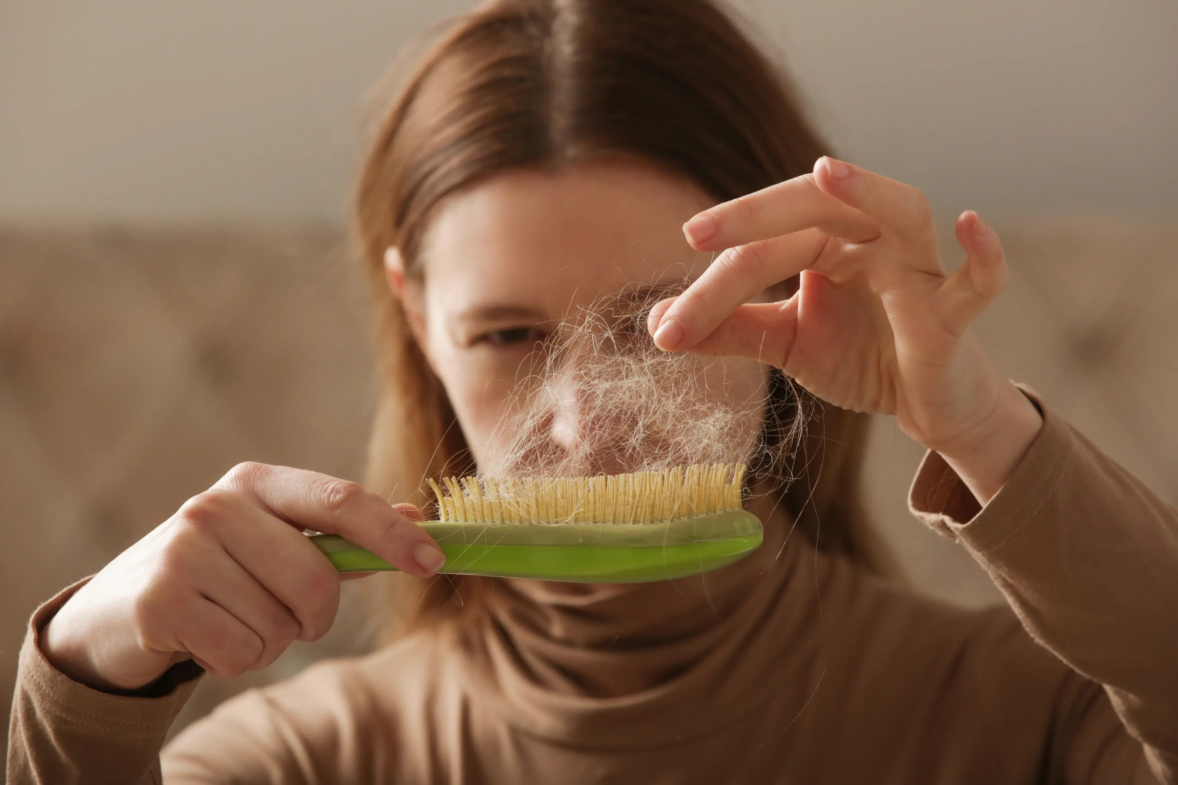 One side effect that's popping up more and more is hair loss (Getty Stock Imgage)