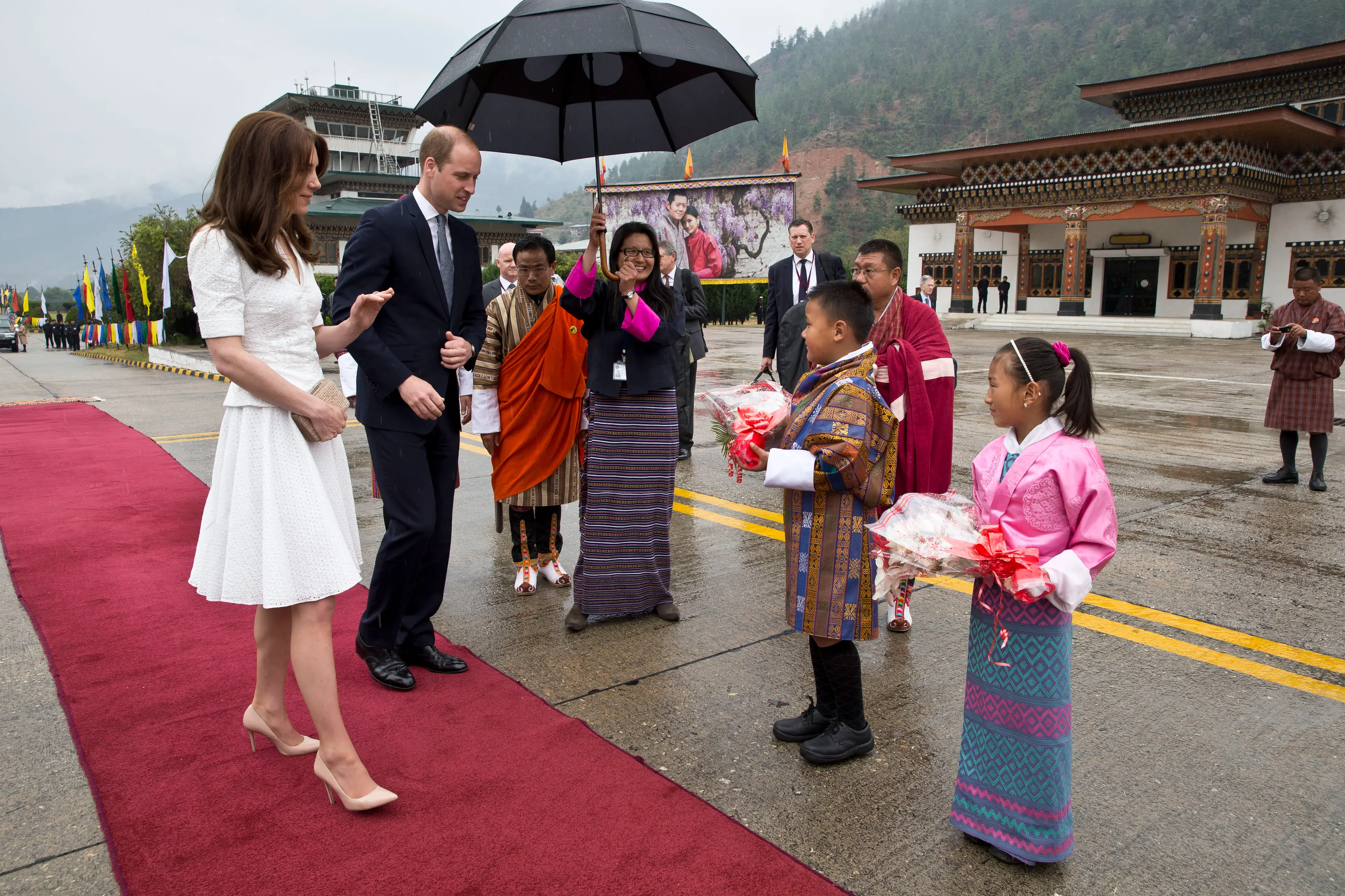 Kate and William presented with flowers as they bid farewell at Paro Airport before boarding their flight to Agra for their visit to the Taj Mahal on April 16, 2016 in Paro, Bhutan (Photo by Heathcliff O'Malley-Pool/Getty Images)