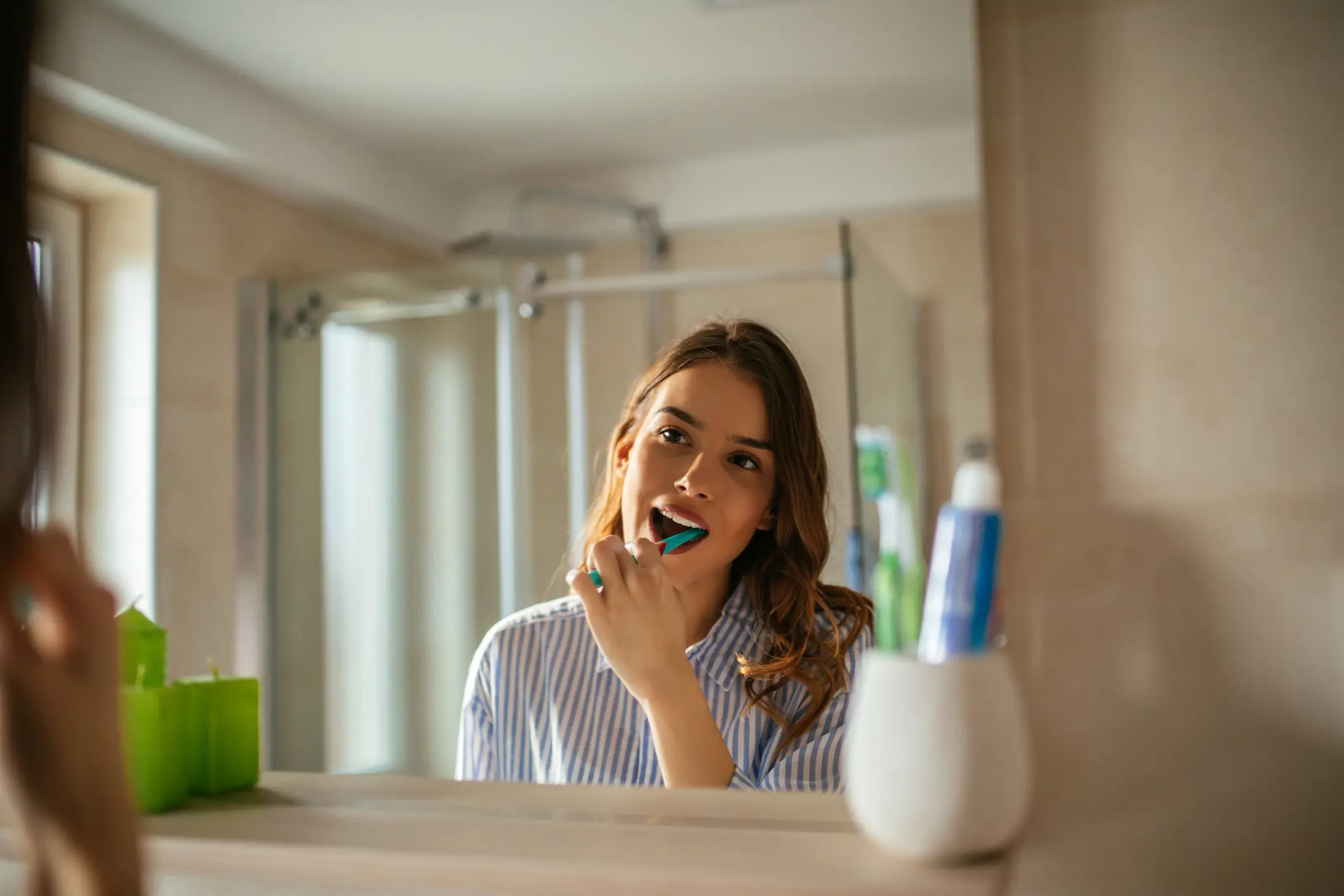 Not brushing your teeth at night could be a reason why you wake up with bad breath (Getty Stock Images)