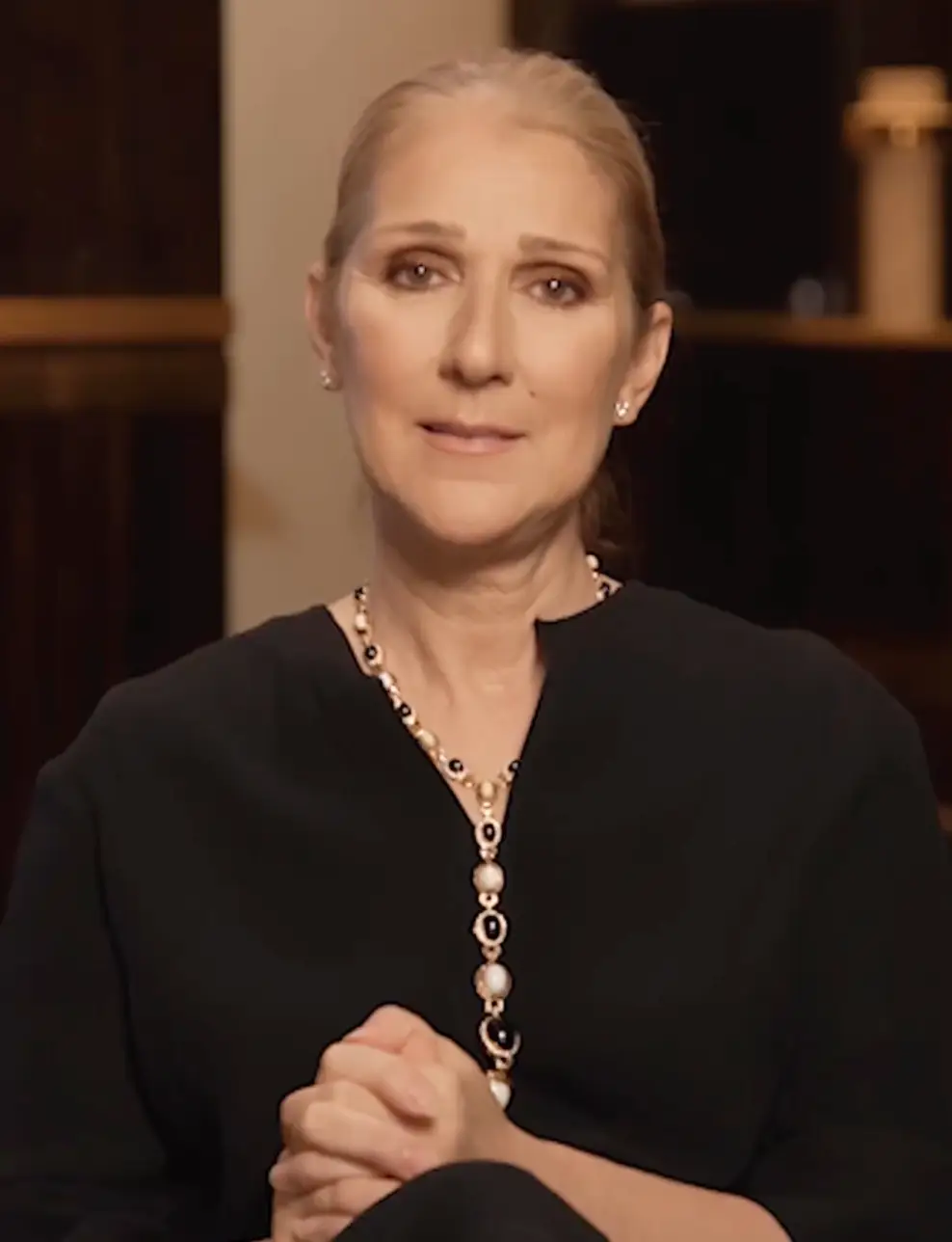 Dion also shared a video with her fans to explain the initial postponement.