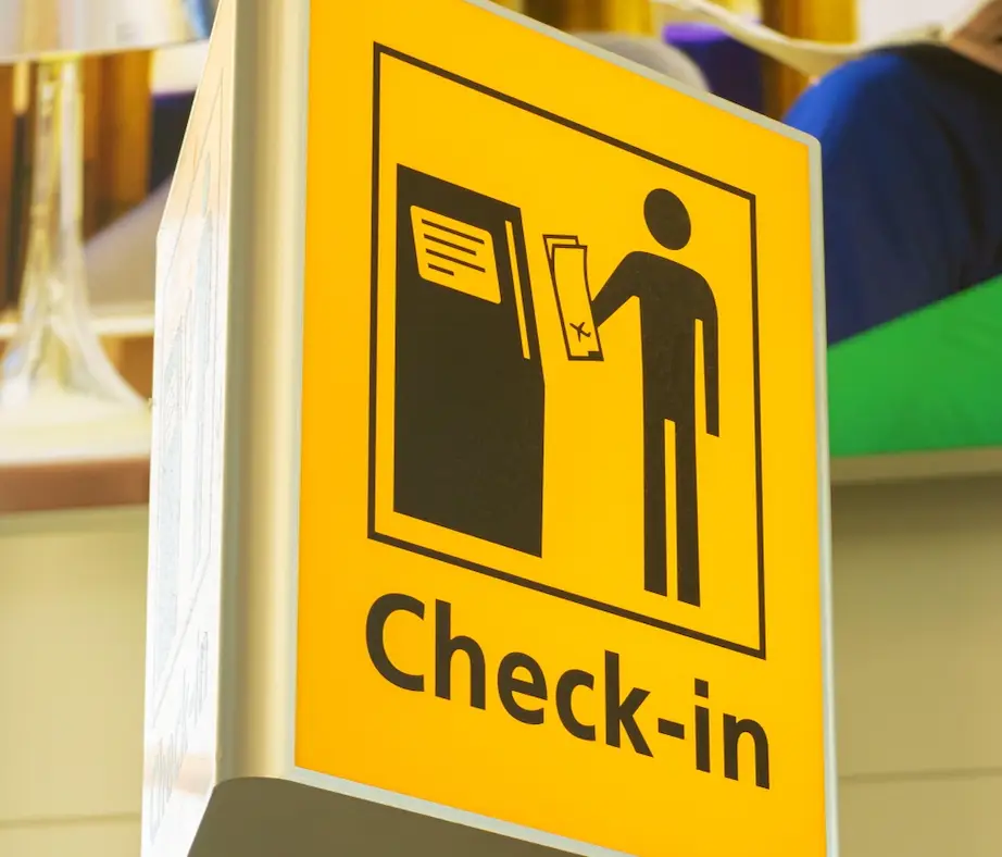 The parents left the baby at the check-in desk.