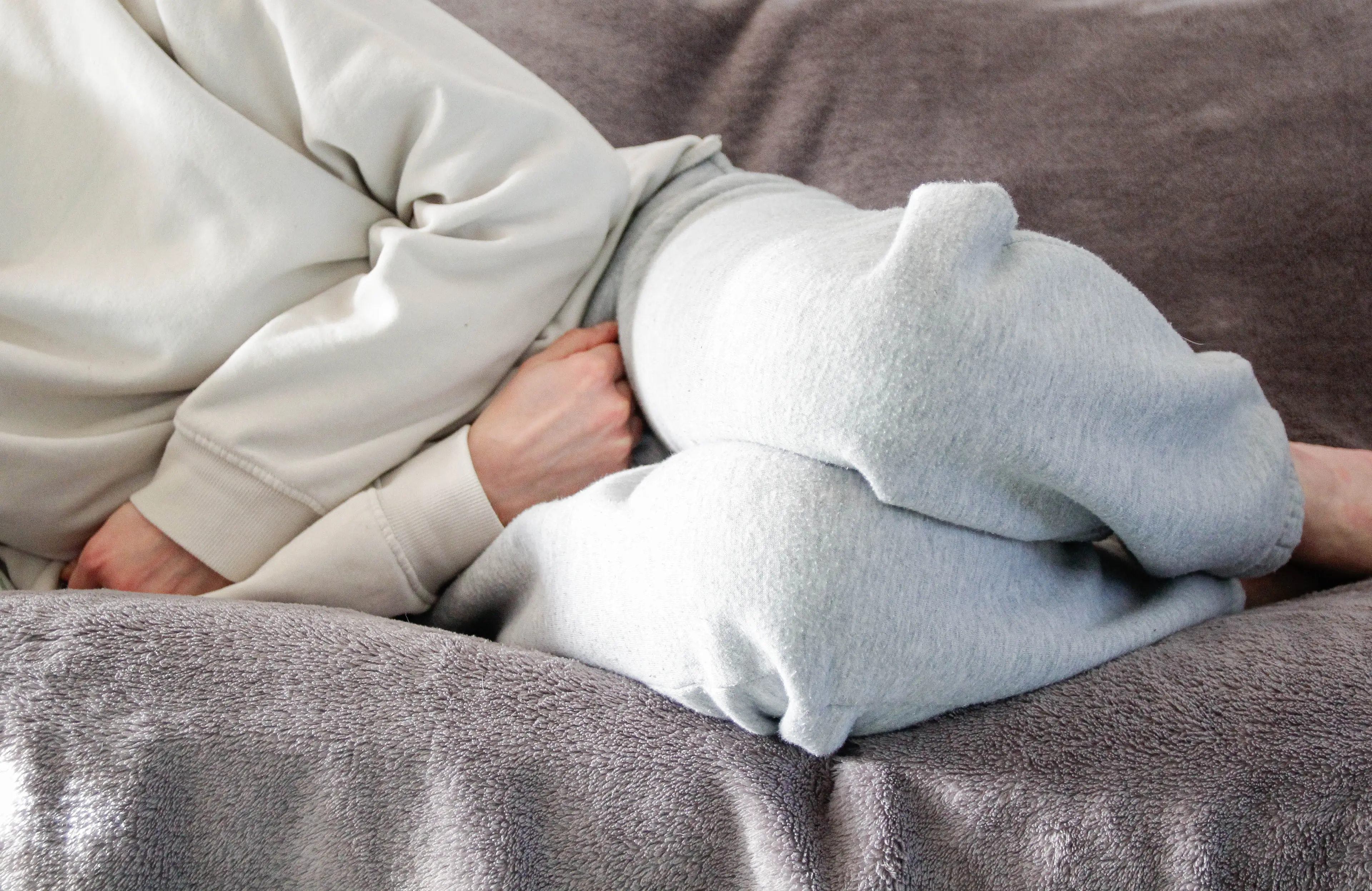 Pain in the back or pelvis can also be another indicator of cervical cancer (Kinga Krzeminska/Getty)