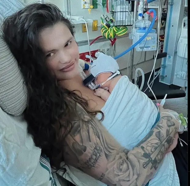 Saffron's newborn daughter, Marina, has been spoilt by her grandpa.