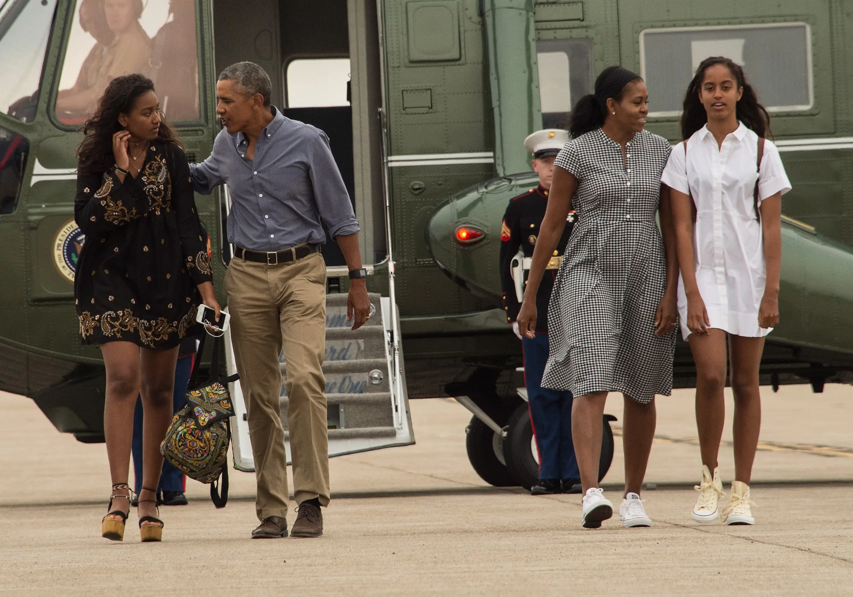 The Obamas with daughters Malia and Sasha in 2016 (NICHOLAS KAMM/AFP via Getty Images)