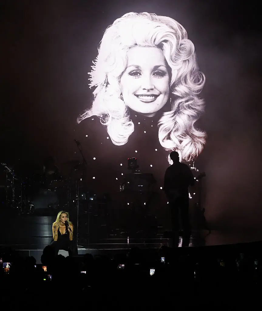 Cyrus got emotional as she dedicated the concert to Parton on stage (Kevin Mazur/Getty Images)