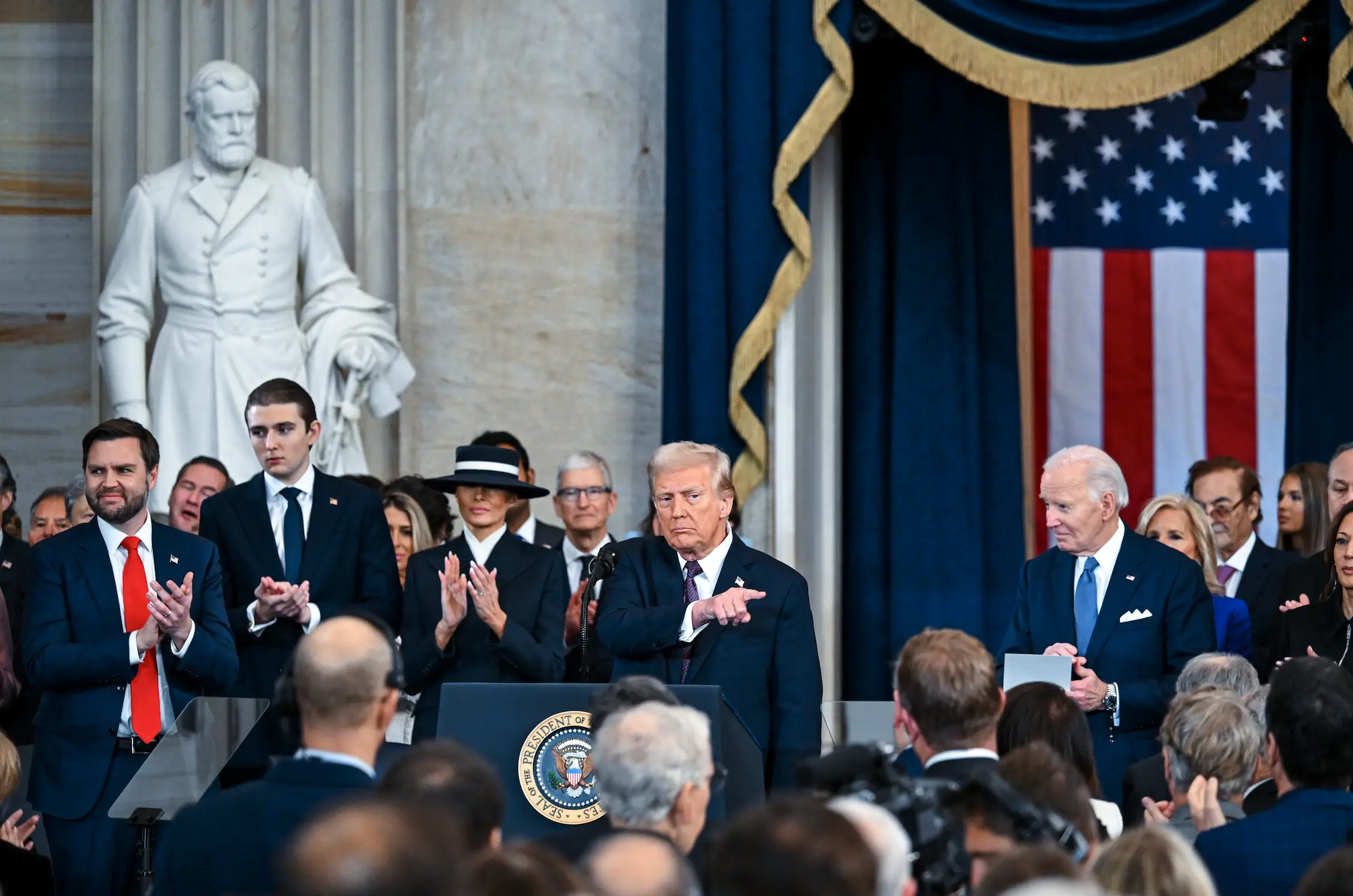 Barron and Trump caught up at inauguration (Kenny Holston-Pool/Getty Images)